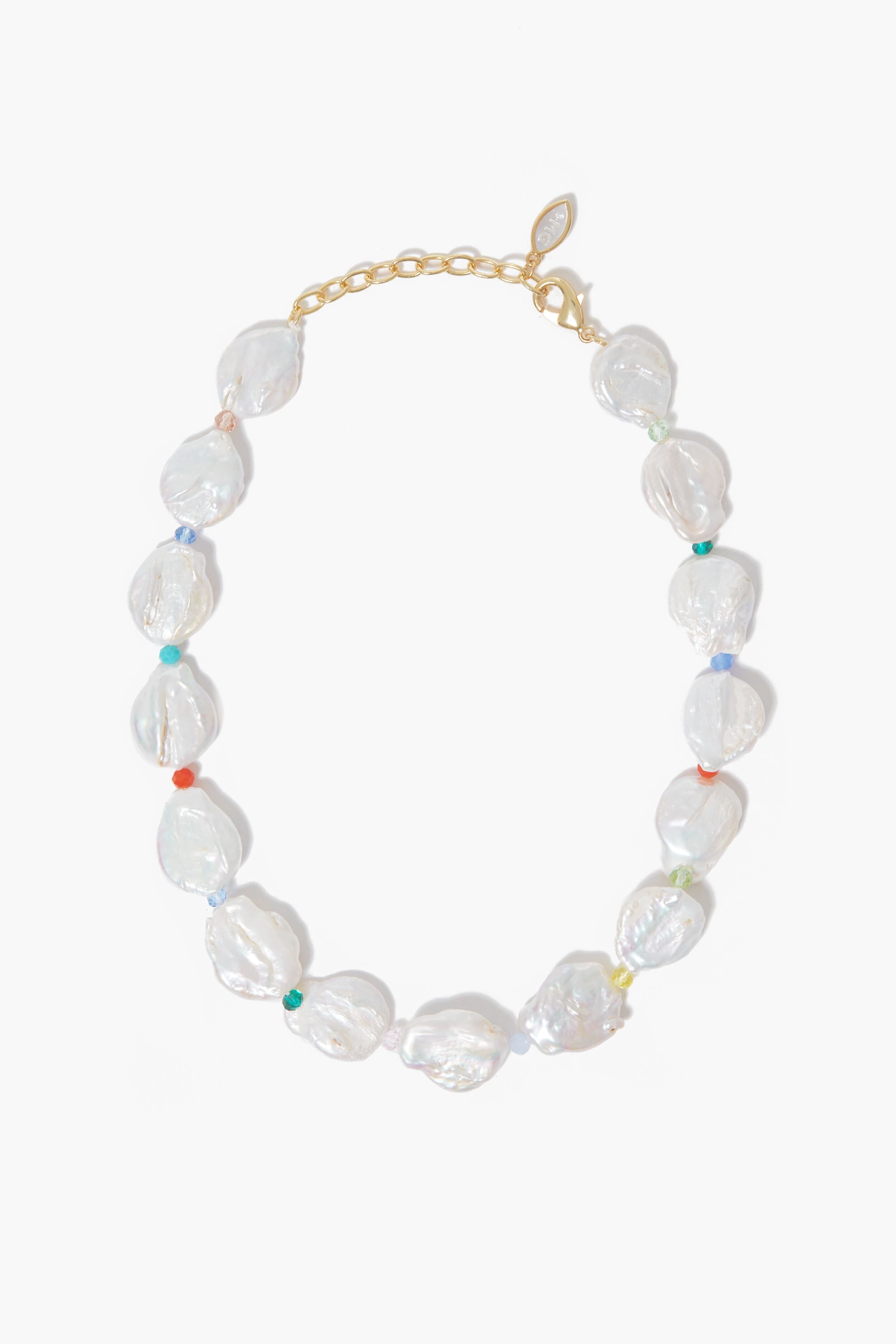 A Mignonne Gavigan beaded necklace with large irregular freshwater pearls, small multicolored beads between each pearl, and a gold chain with clasp in the brand’s signature style.