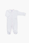 Nella Pima white baby onesie with long sleeves, covered feet, and snap buttons down the front. Features soft pink trim and is made from luxurious Peruvian Pima cotton—perfect as cozy baby footie pajamas.