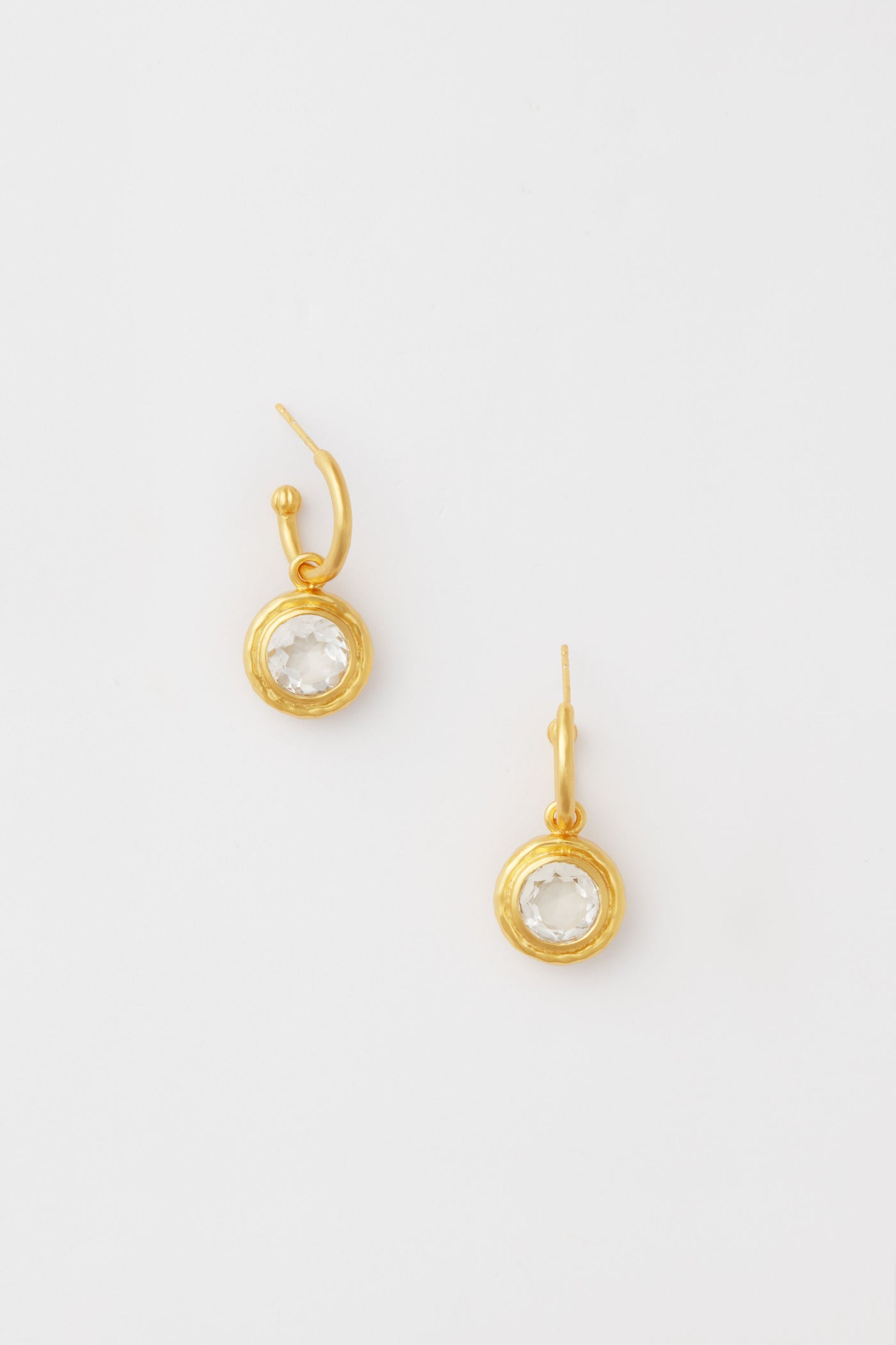 Two gold-plated VALERE hoop earrings with round clear gemstone pendants—perfect as crystal dangle earrings and a stunning addition to your handcrafted jewelry collection.