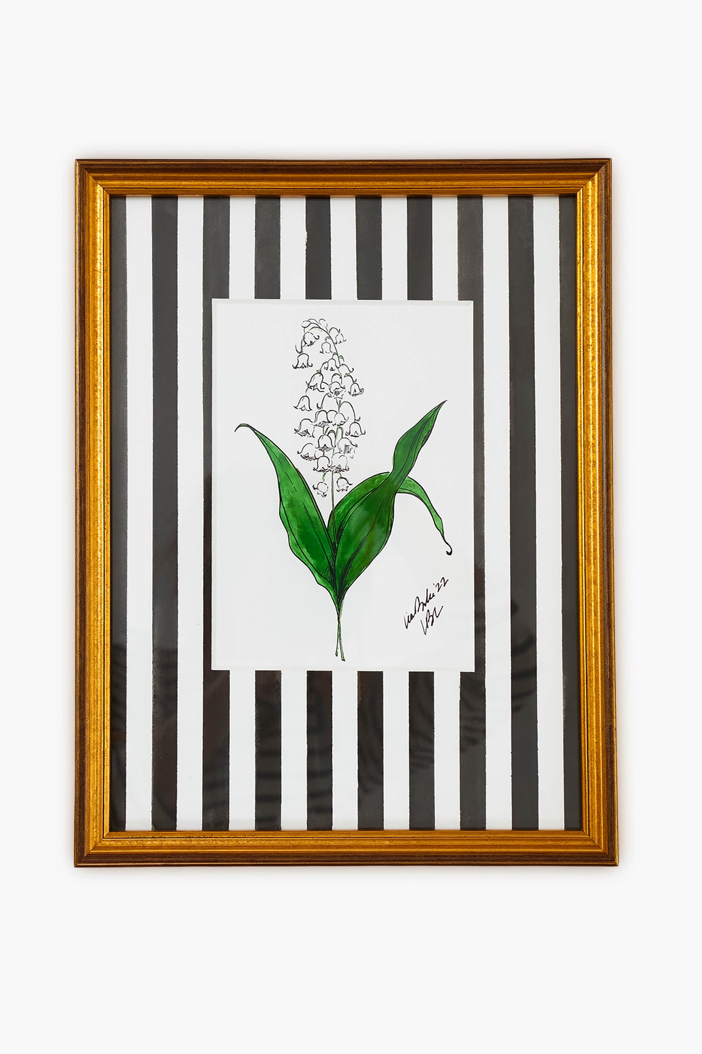 A Lia Burke Libaire framed artwork featuring Lily of the Valley blooms set against black and white vertical stripes.
