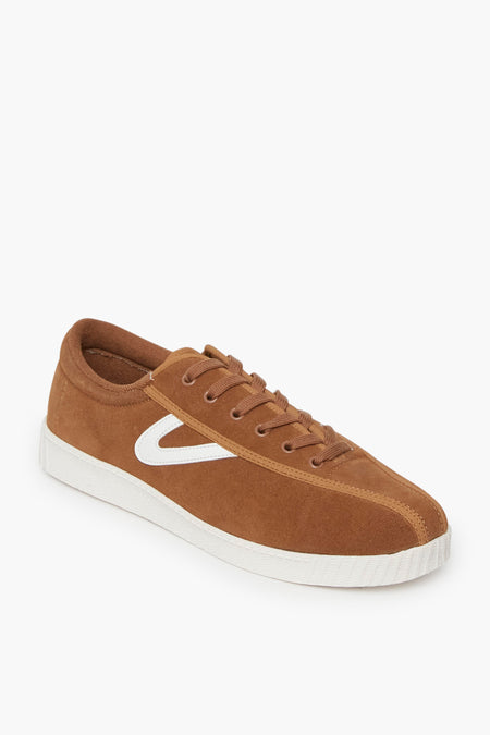 Tretorn brown suede sneaker with white rubber sole, white side logo detail, and brown laces, shown at an angle—a modern take on the classic canvas sneaker style.
