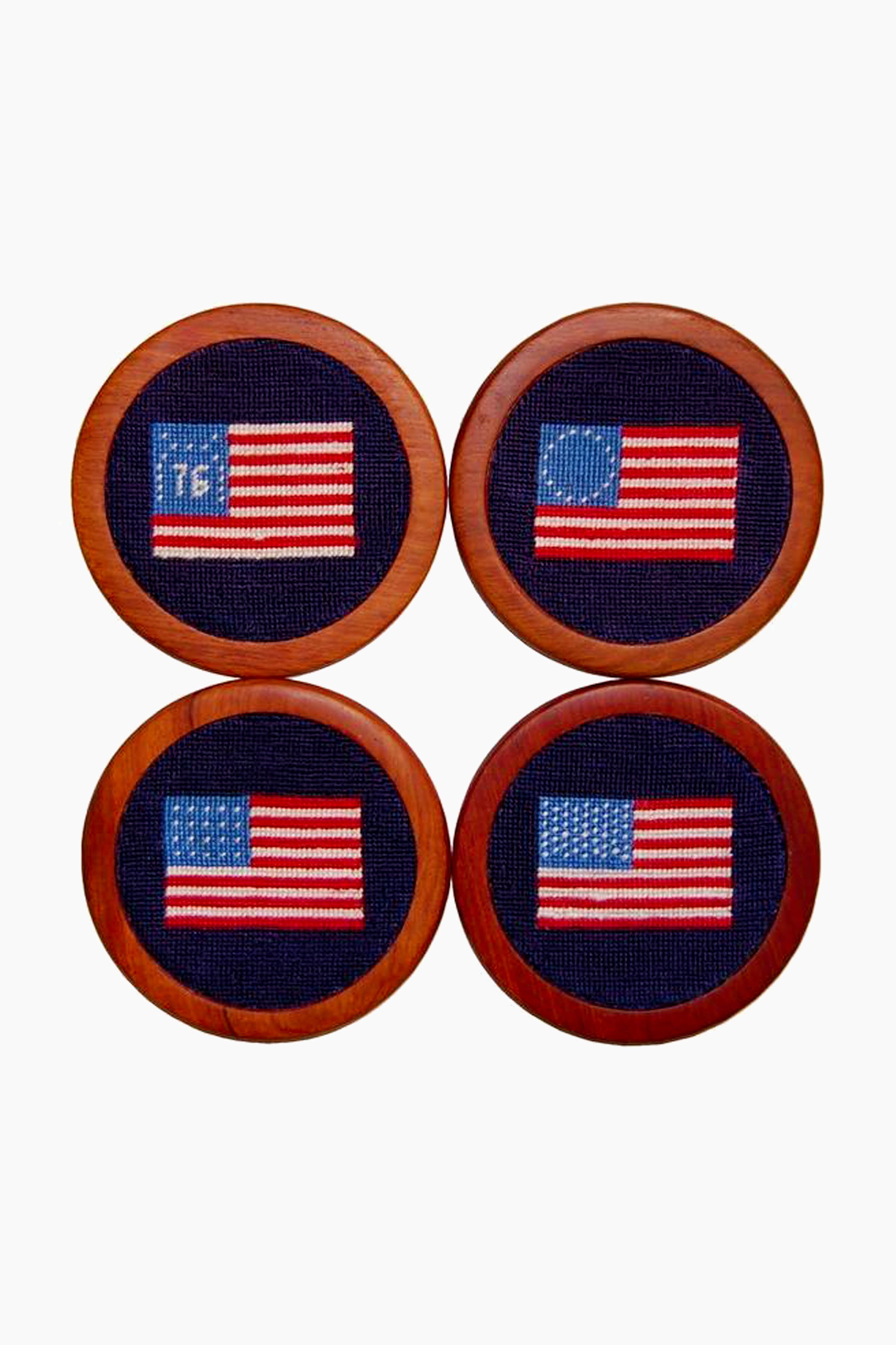 Four hand-stitched coasters by Smathers and Branson, each featuring a unique historical or modern American flag design, are displayed in a 2x2 grid.