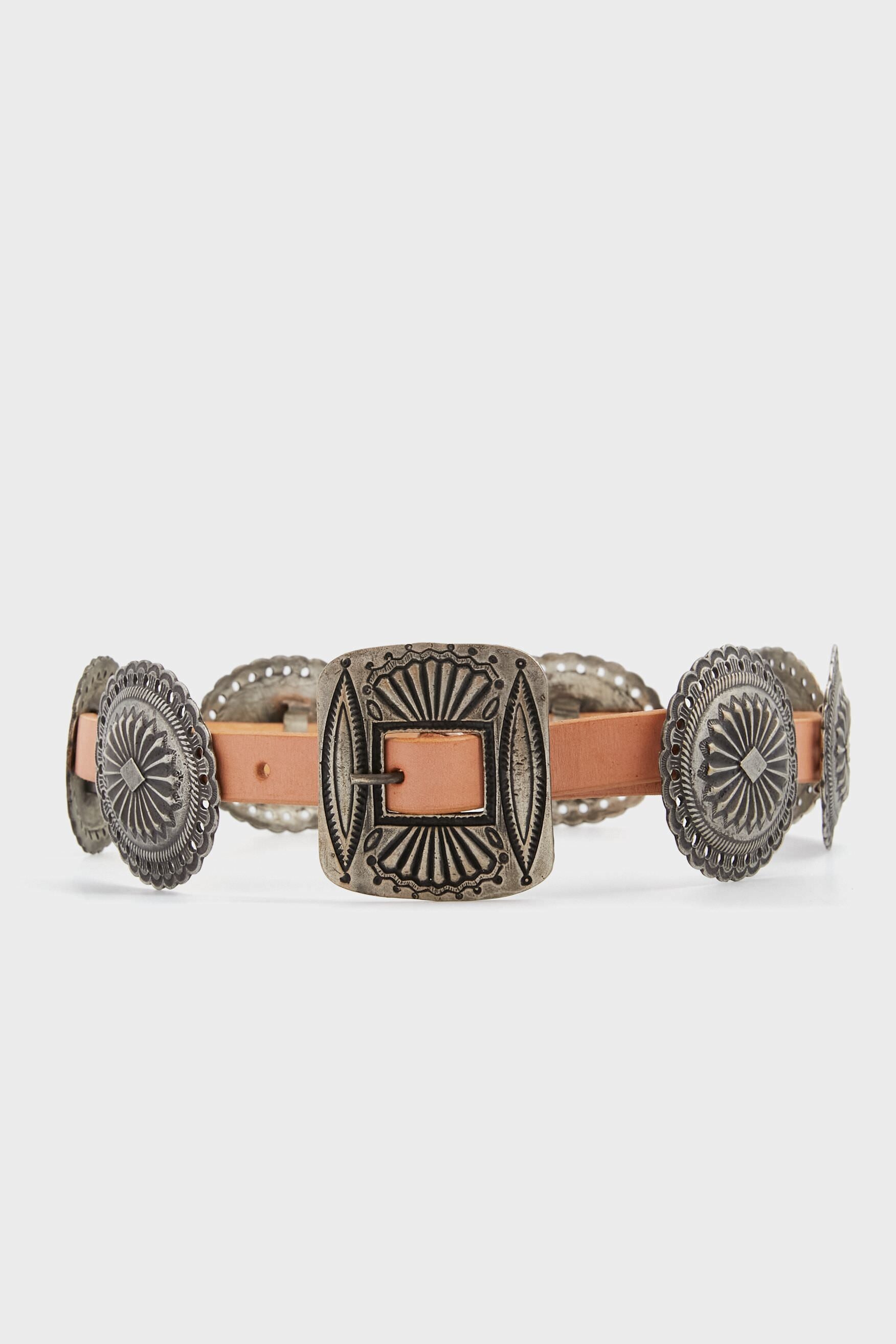 A brown leather belt by Polo Ralph Lauren features embossed silver conchos and a square, engraved silver buckle with classic Western detailing.