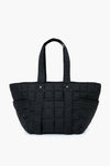 The Clare V black quilted tote bag features two handles, a rectangular shape, and grid stitching. Made from nylon, it’s both stylish and practical—ideal for carrying your essentials in a classic Clare V-inspired design.