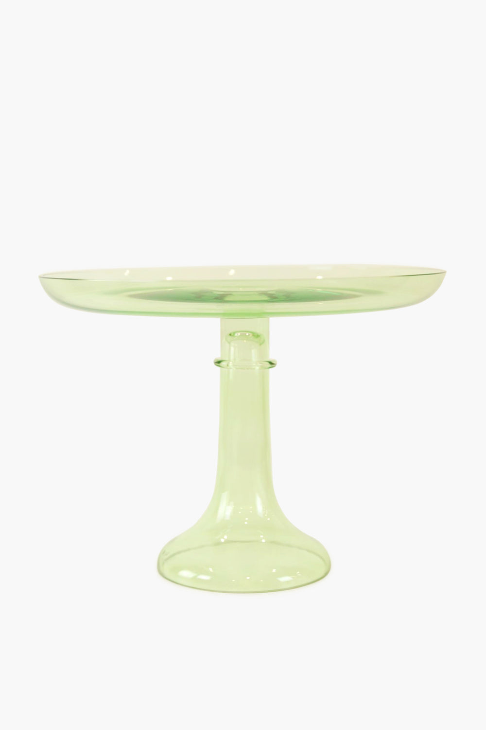 The Estelle Colored Glass cake stand, crafted from hand-blown translucent light green glass, features a wide flat top and sturdy pedestal base, lending your table a luxurious stemware-inspired look.