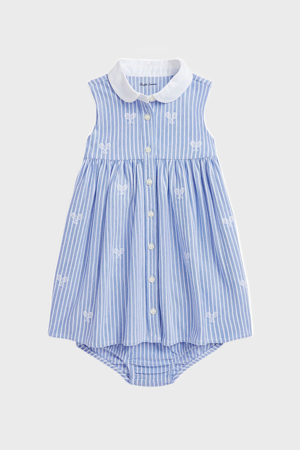 Sleeveless Polo Ralph Lauren baby dress with blue and white vertical stripes, mesh tennis embroidery, white front buttons, a white collar, and a matching attached bloomer set.