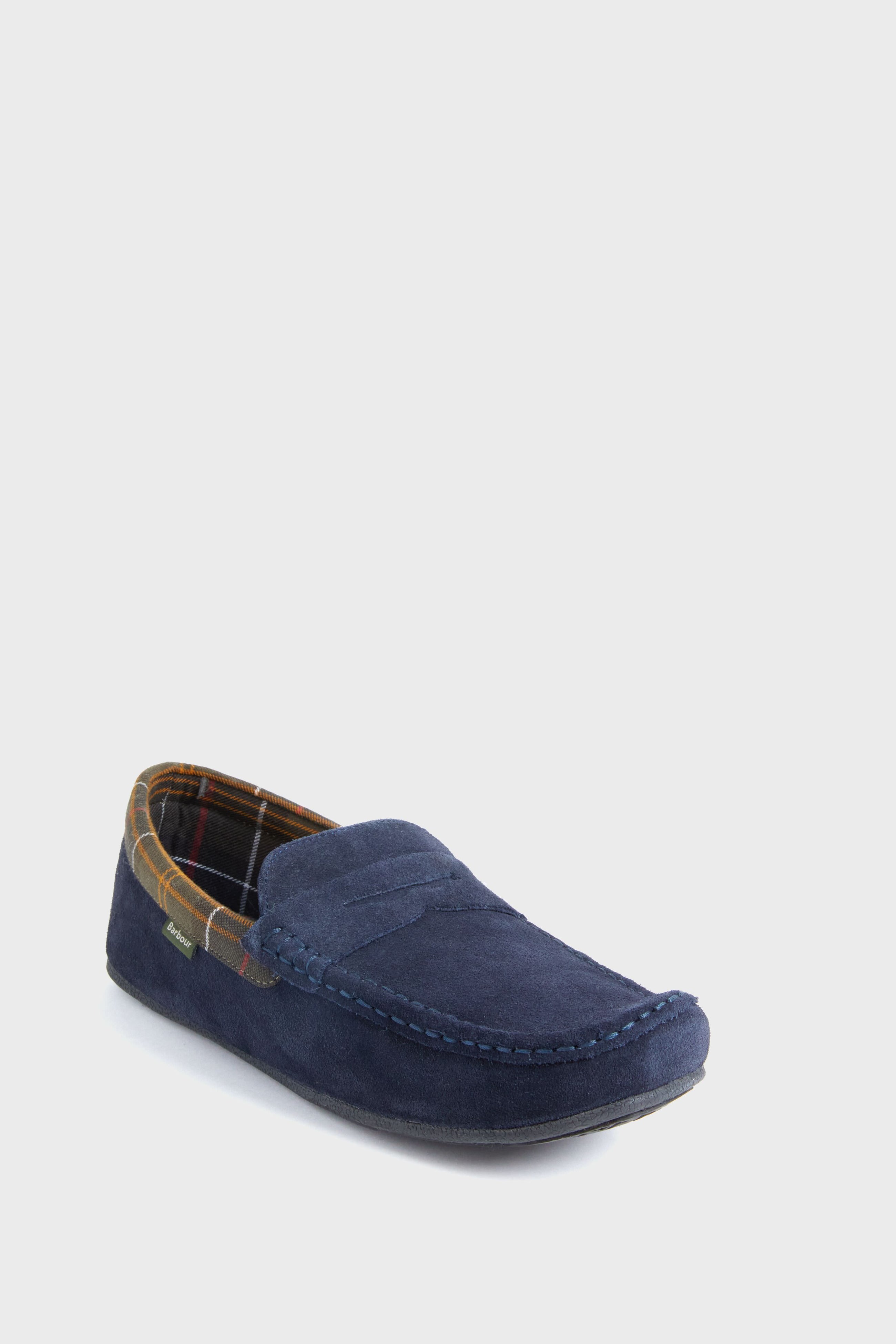 A single Barbour navy blue suede loafer with visible stitching and a plaid-patterned lining, highlighting the classic penny loafer style.