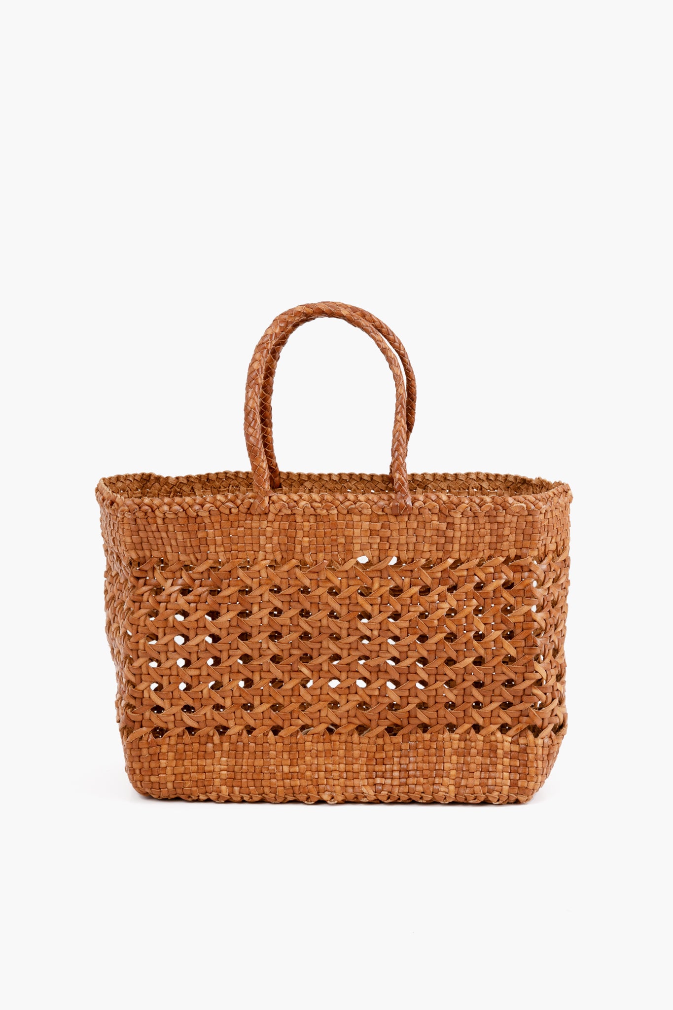 Dragon Diffusion presents a rectangular handmade tote crafted from woven straw, featuring two handles and showcasing thoughtful craftsmanship.