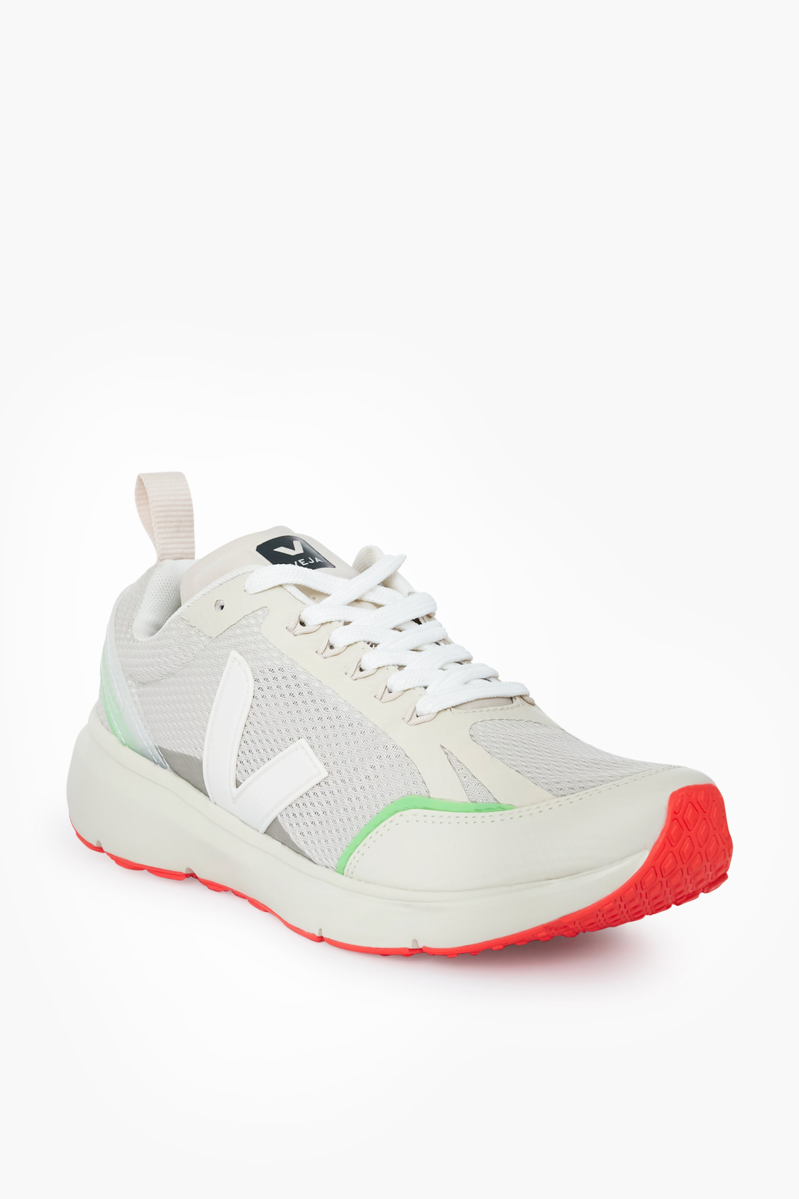 The VEJA Condor 2 sneaker in white and light beige features recycled materials, mesh panels, white laces, a signature white V logo on the side, and a red textured sole tip.