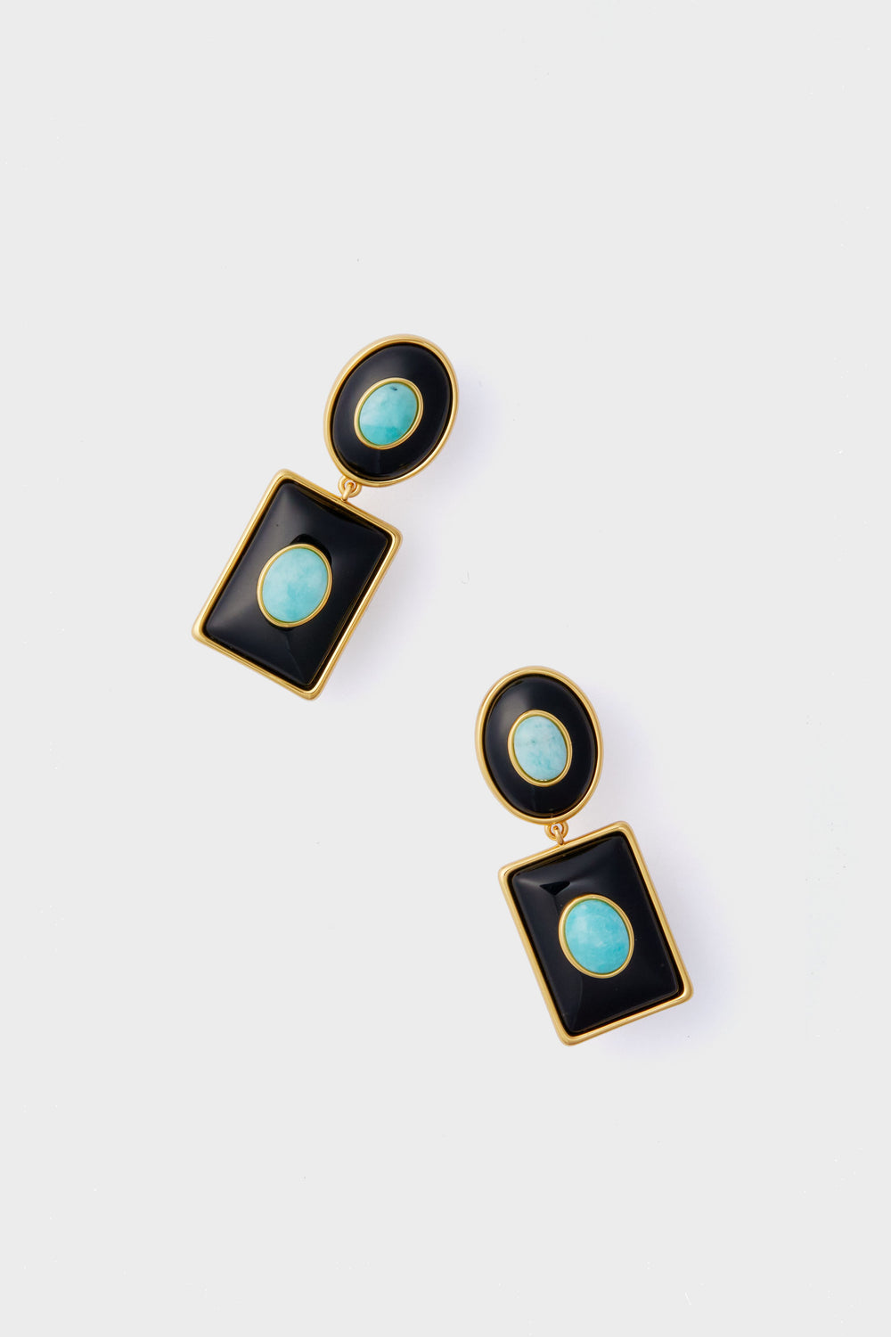 A pair of gold-framed Amazonite earrings with oval turquoise stones in black geometric shapes from the Lizzie Fortunato Midnight Ethereal Pool Earrings handcrafted collection.