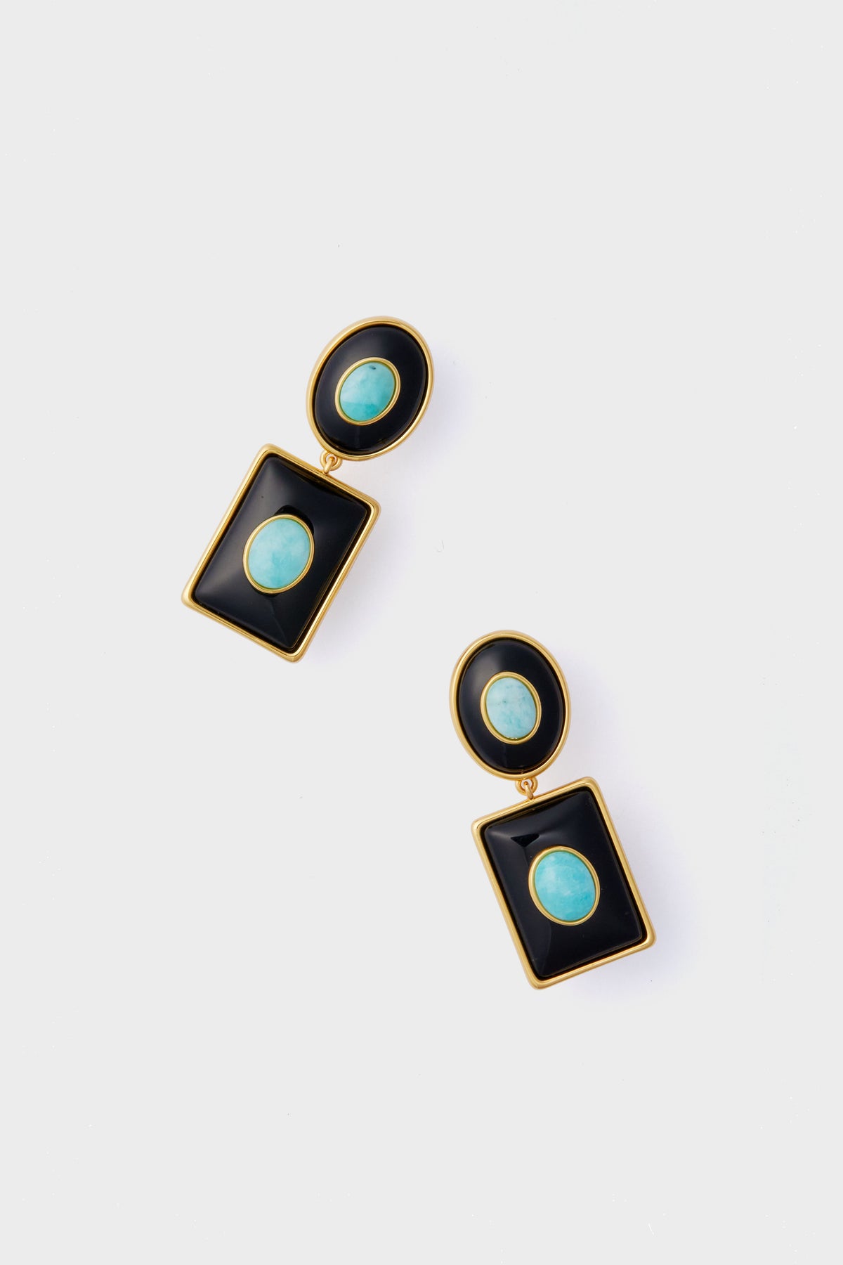 A pair of gold-framed Amazonite earrings with oval turquoise stones in black geometric shapes from the Lizzie Fortunato Midnight Ethereal Pool Earrings handcrafted collection.