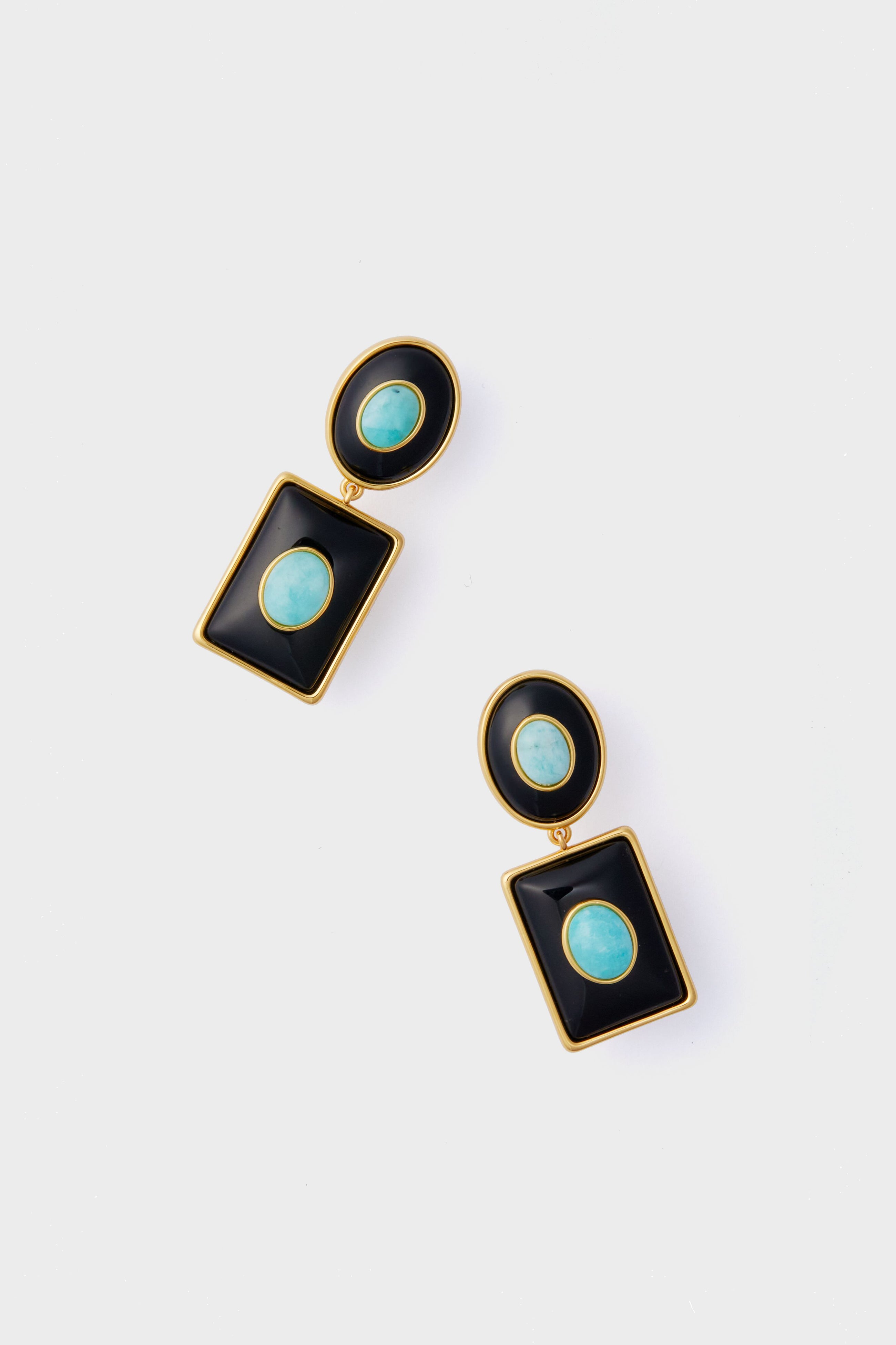 A pair of gold-framed Amazonite earrings with oval turquoise stones in black geometric shapes from the Lizzie Fortunato Midnight Ethereal Pool Earrings handcrafted collection.