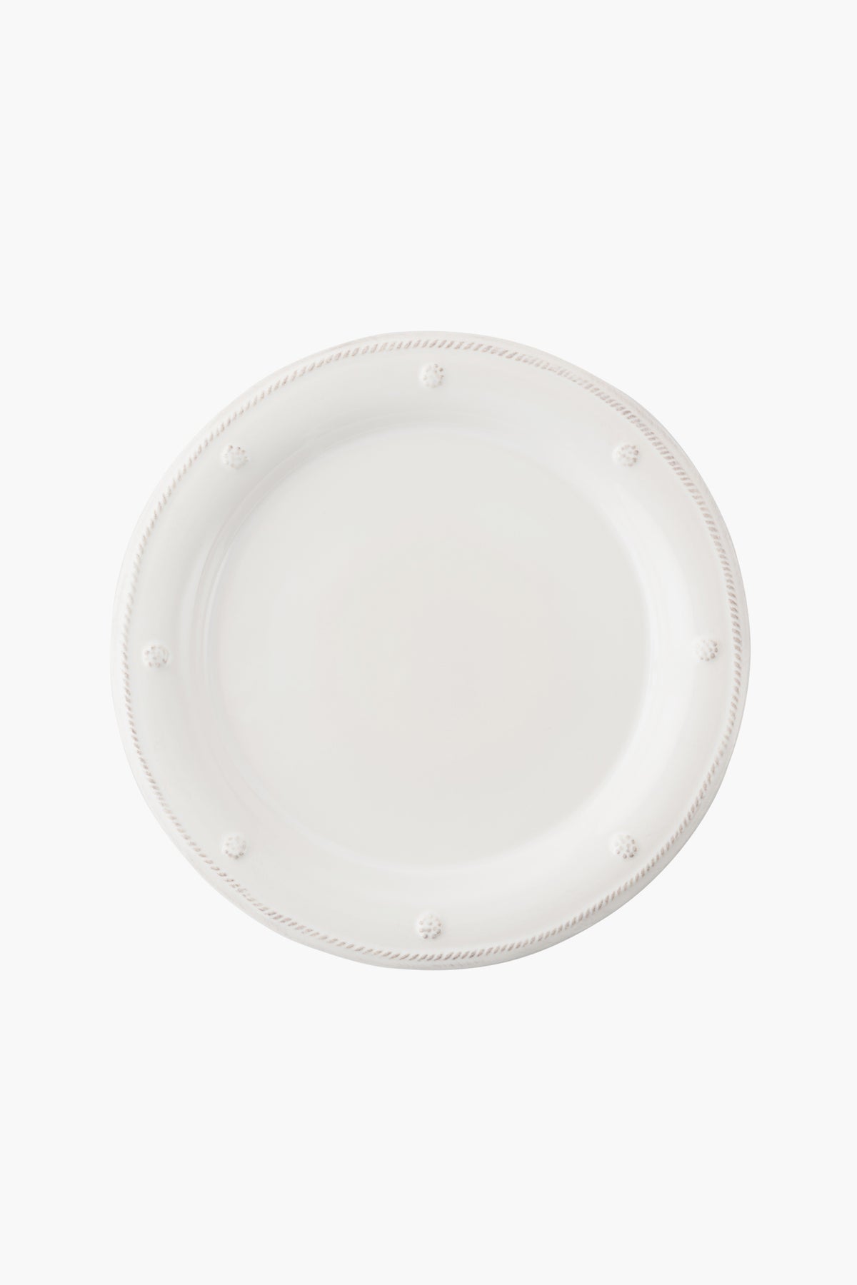 A round, plain white ceramic stoneware dinner plate by Juliska featuring Berry & Thread's raised dotted and rope-like border design, viewed from above.