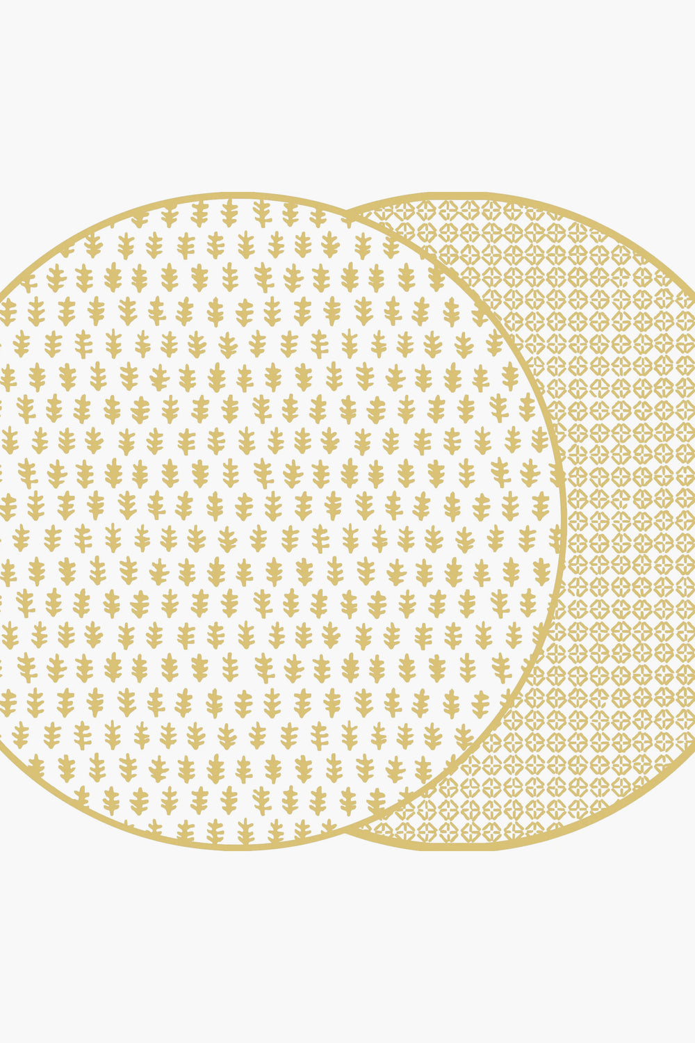 Holly Stuart Home offers two overlapping round mats with gold patterns, featuring a small leaf design on the front and a geometric pattern on the back. These handcrafted table decor pieces double as reversible placemats for versatility.