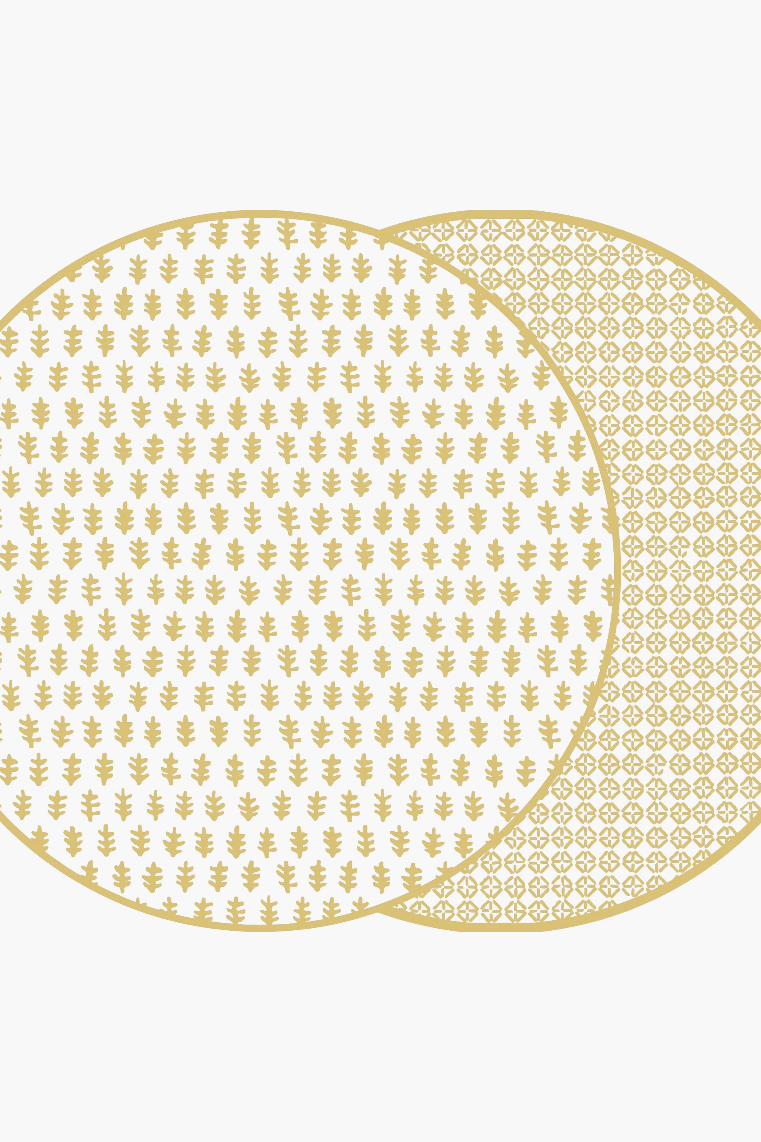 Holly Stuart Home offers two overlapping round mats with gold patterns, featuring a small leaf design on the front and a geometric pattern on the back. These handcrafted table decor pieces double as reversible placemats for versatility.