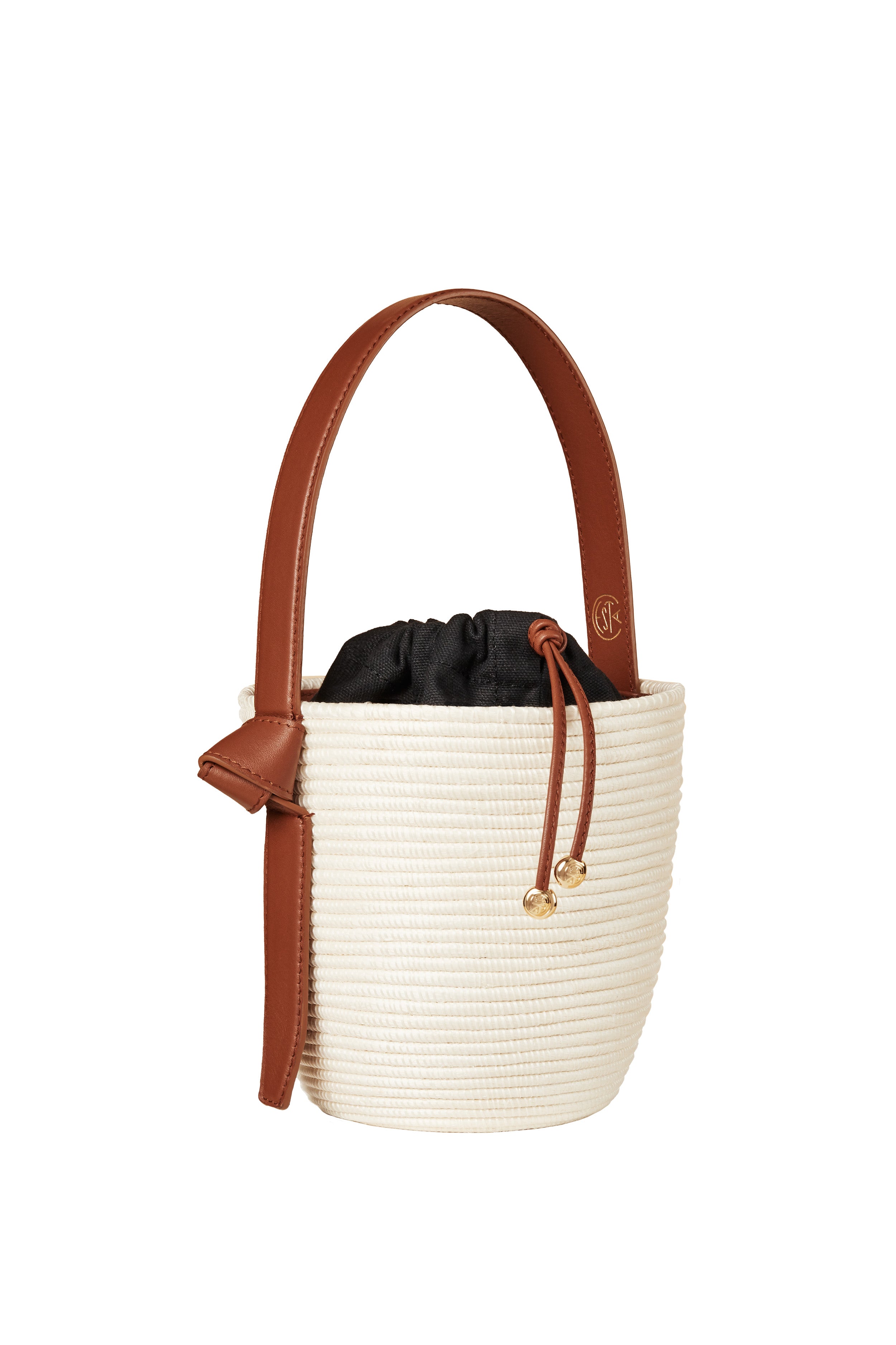 A white and brown Cesta Collective bag, crafted in a sustainable style—perfect for anyone who values ethical accessories.