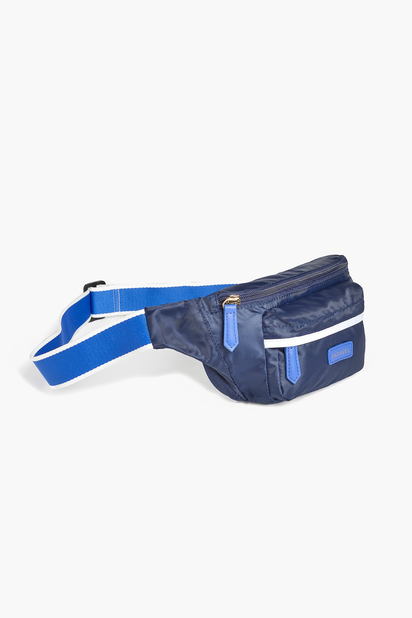The Paravel belt bag features a navy blue design with a white stripe and blue accents, a zippered main compartment, and an adjustable strap with a plastic buckle.