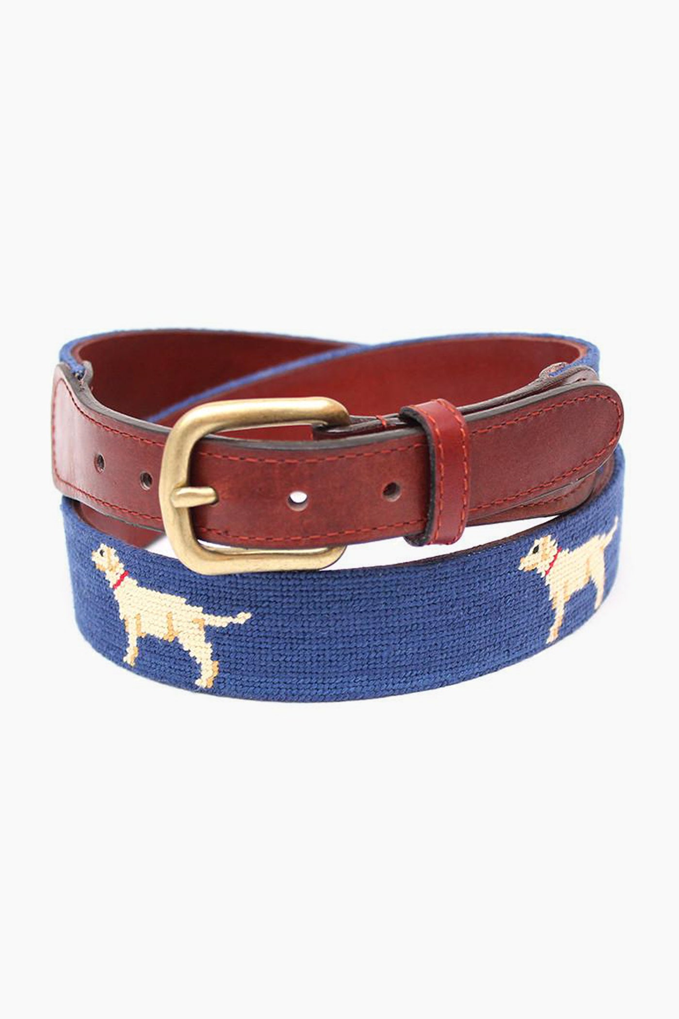 The Smathers and Branson blue needlepoint belt features brown leather trim, a brass buckle, and hand-stitched yellow dog motifs—an ideal gift for dog lovers.