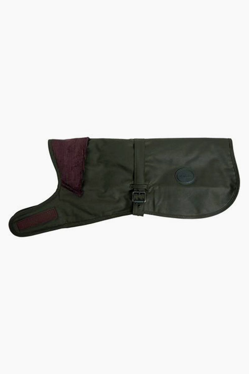 A Barbour dog jacket in dark green waxed cotton, featuring waterproof material, a buckle strap, and a maroon corduroy collar, shown laid flat.