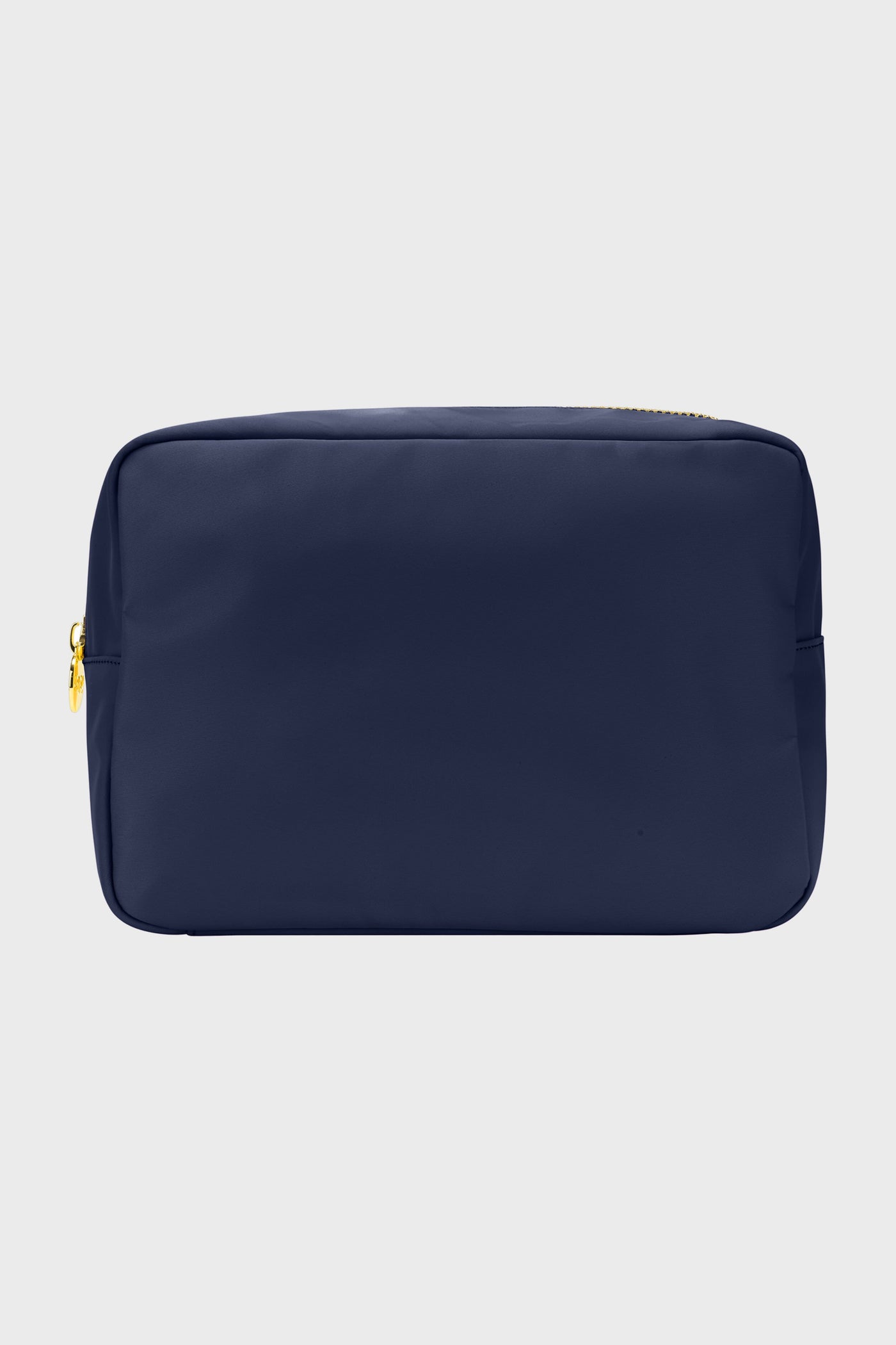 The Stoney Clover Lane rectangular navy blue zippered pouch features gold zipper hardware, ideal for organization or as a large travel accessory.