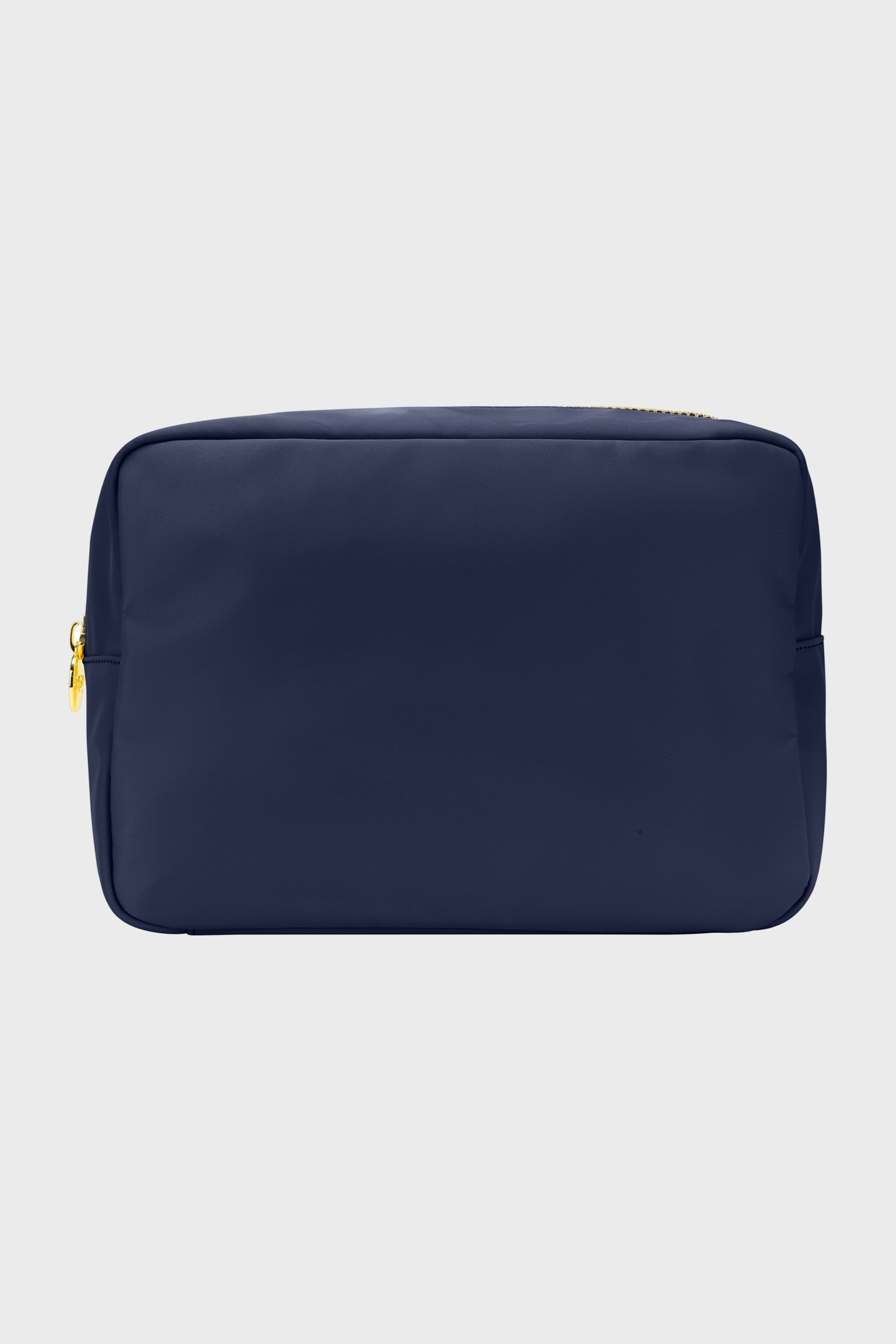 The Stoney Clover Lane rectangular navy blue zippered pouch features gold zipper hardware, ideal for organization or as a large travel accessory.