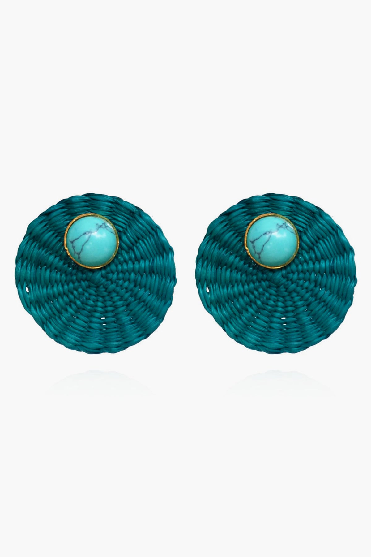 Ana Carolina Valencia round teal woven turquoise stud earrings feature a central turquoise stone framed by a thin gold-plated bronze rim—a stunning piece of handmade jewelry.