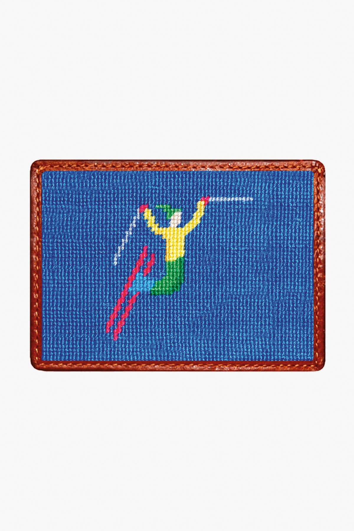 A Smathers and Branson rectangular needlepoint card wallet featuring a skier in yellow and green, bordered with brown leather.