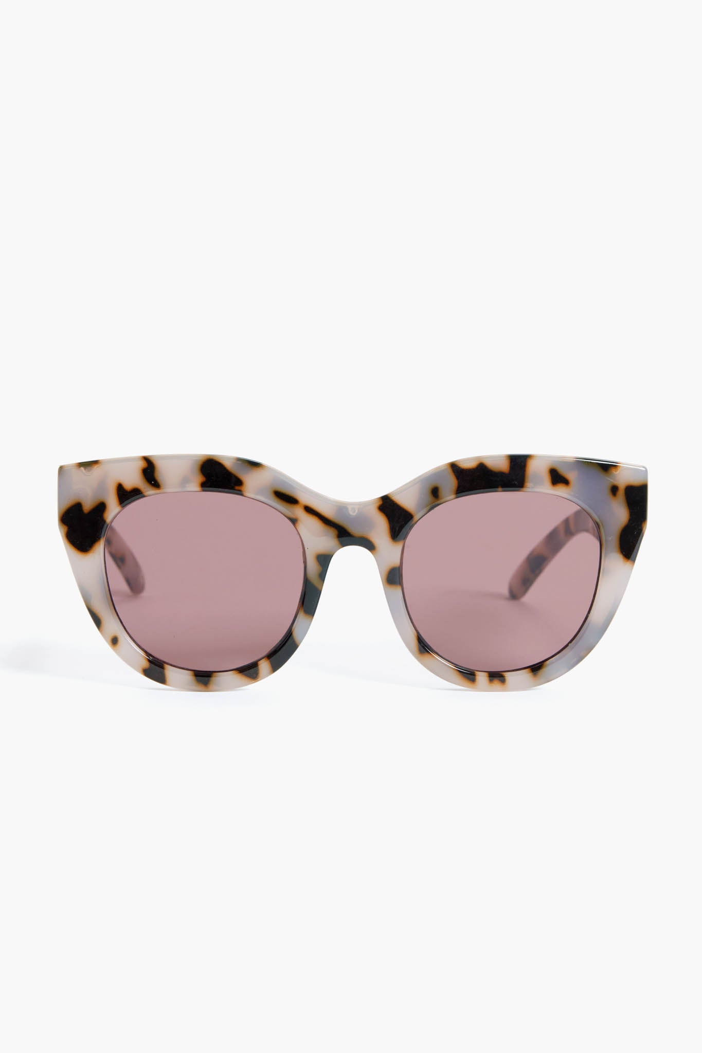 Le Specs cat eye sunglasses with a tortoiseshell frame and pink-tinted lenses.
