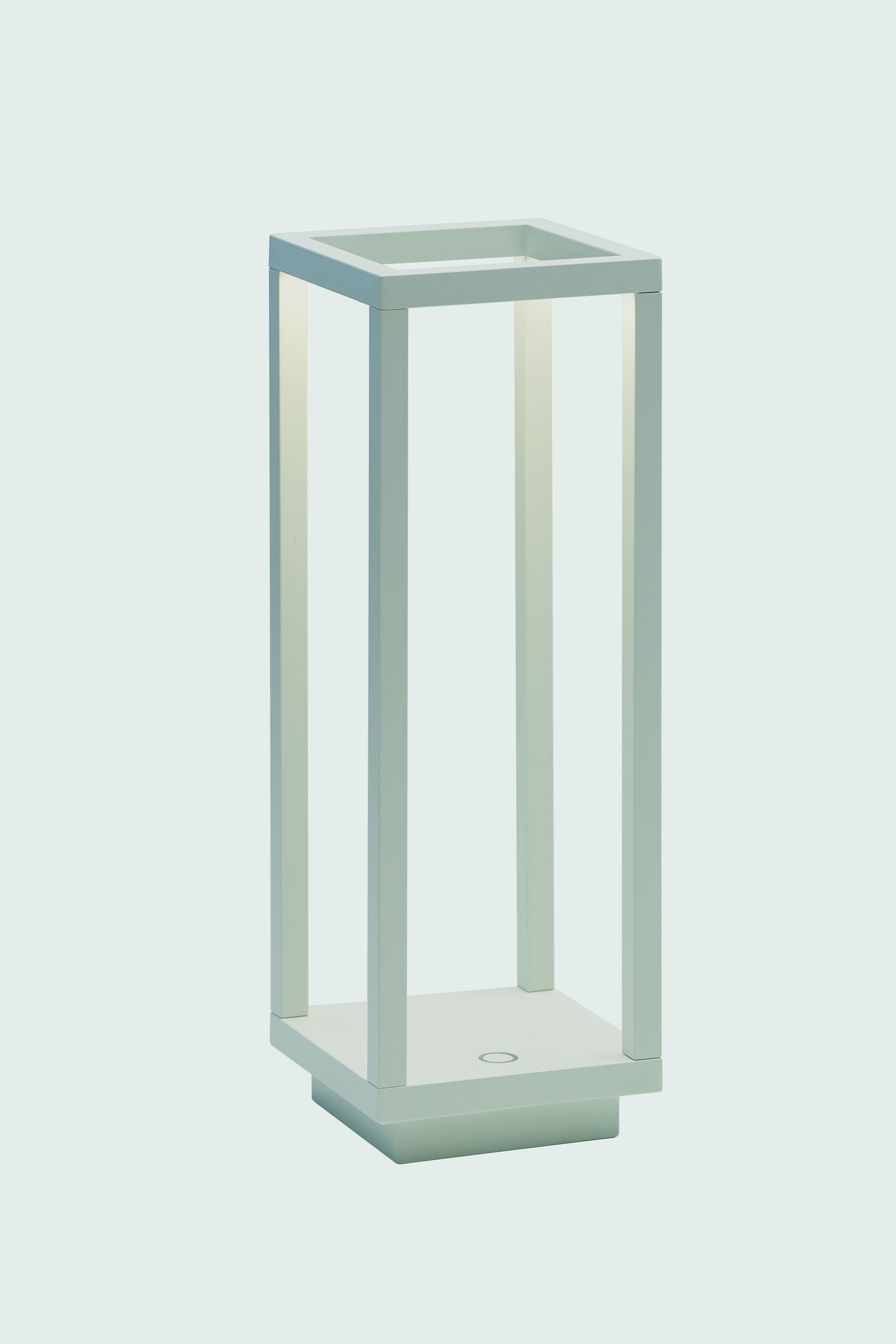 A modern, minimalist rectangular table lamp by Zafferano, featuring an open frame design, soft white light, Italian styling, and cordless rechargeable convenience.