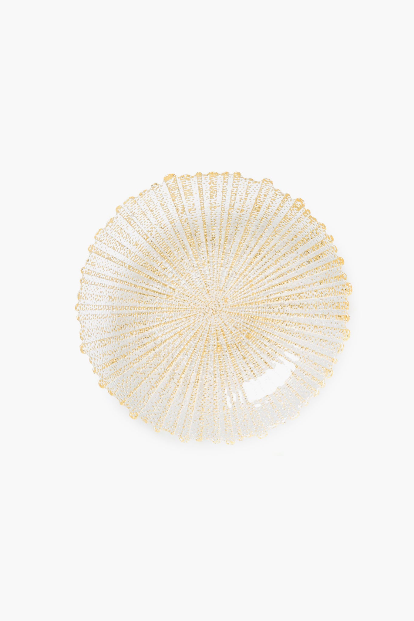 A round, clear handmade glass bowl by Vietri features a radiating gold sun ray pattern, expertly crafted by Italian artisans.