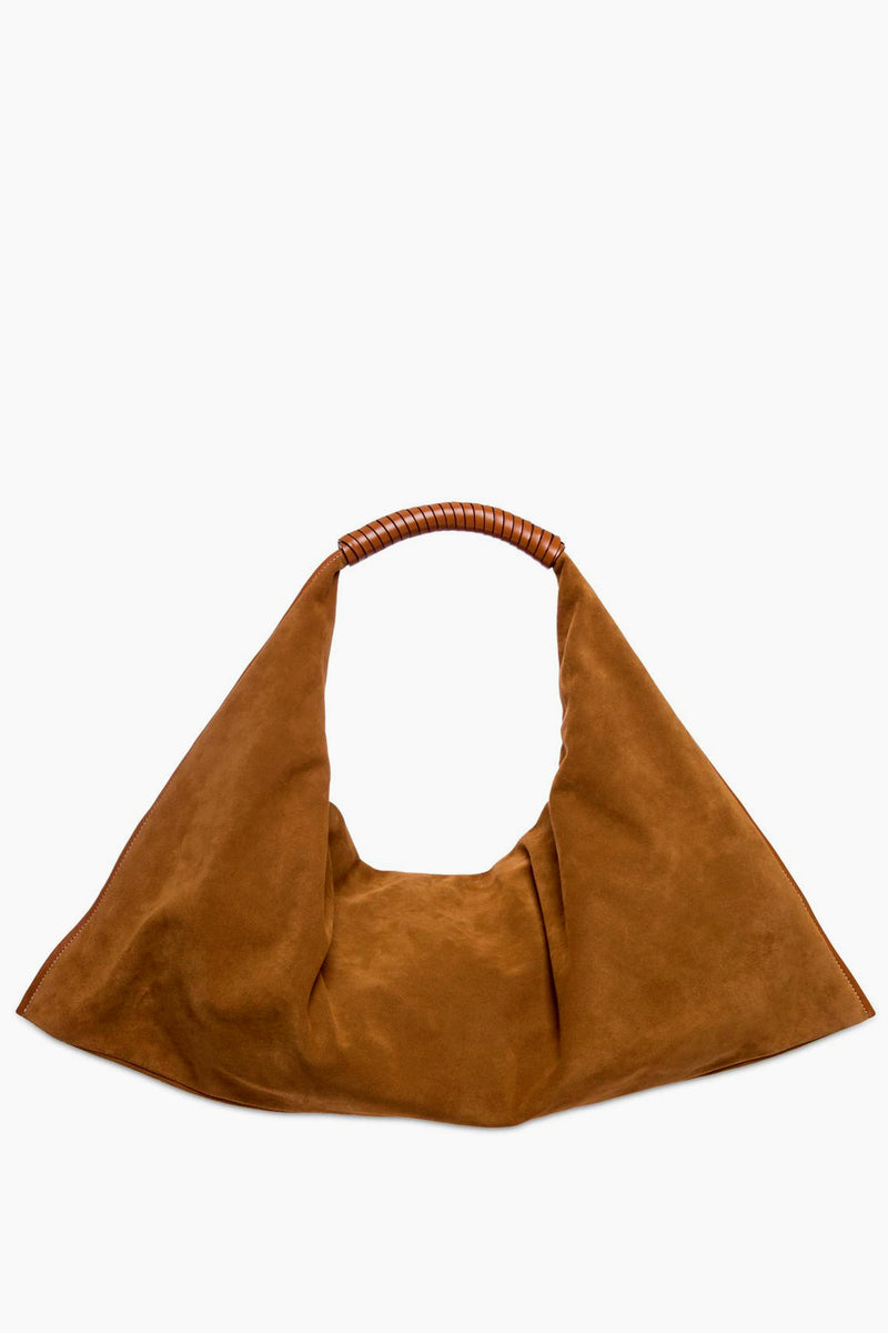 STAUD brown suede shoulder bag features a wide, triangular silhouette and a short leather-wrapped handle. This slouchy design blends style and practicality for a chic everyday accessory.