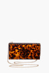 ASHA rectangular tortoise pattern clutch with a cutout floral motif, thin metal chain strap, and chic acrylic design.