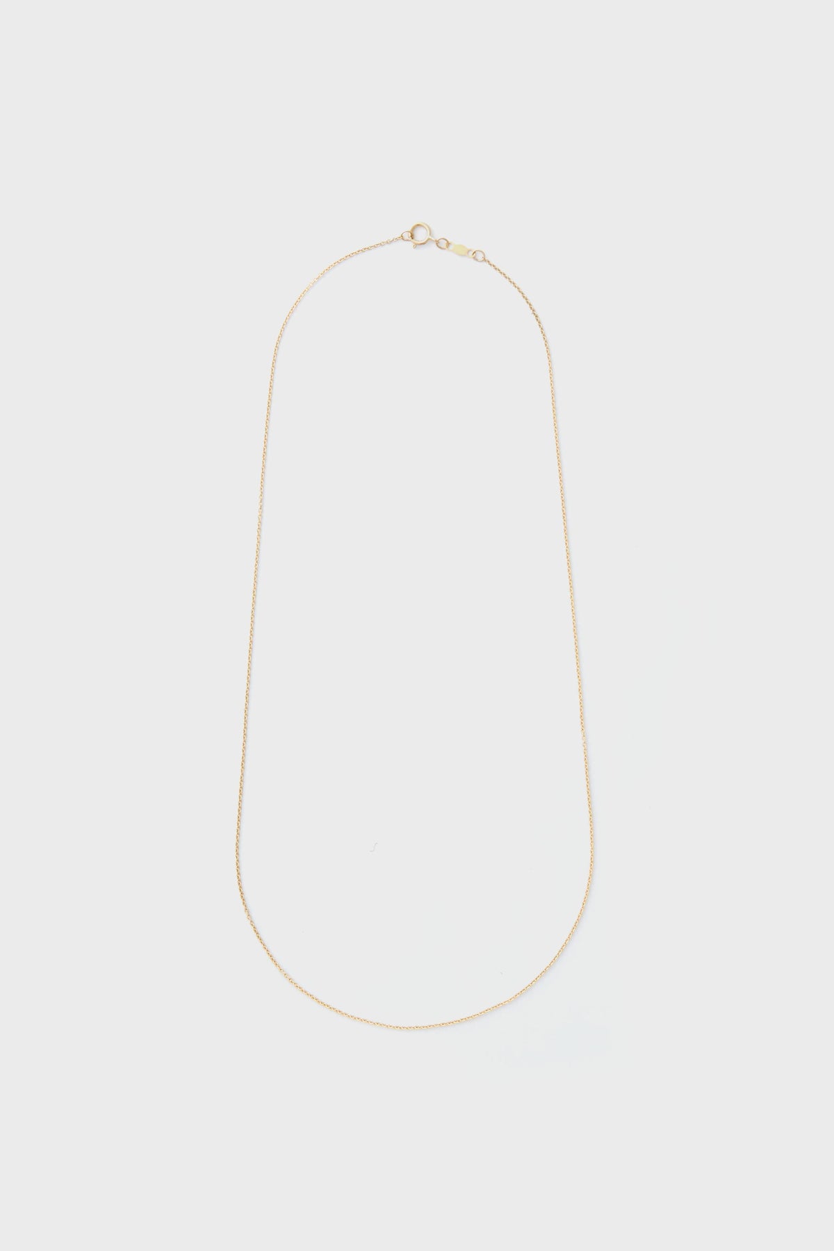 The Tuckernuck Fine Jewelry 14k gold rope chain necklace features a thin design and a small round clasp, ideal for those who appreciate luxury jewelry.