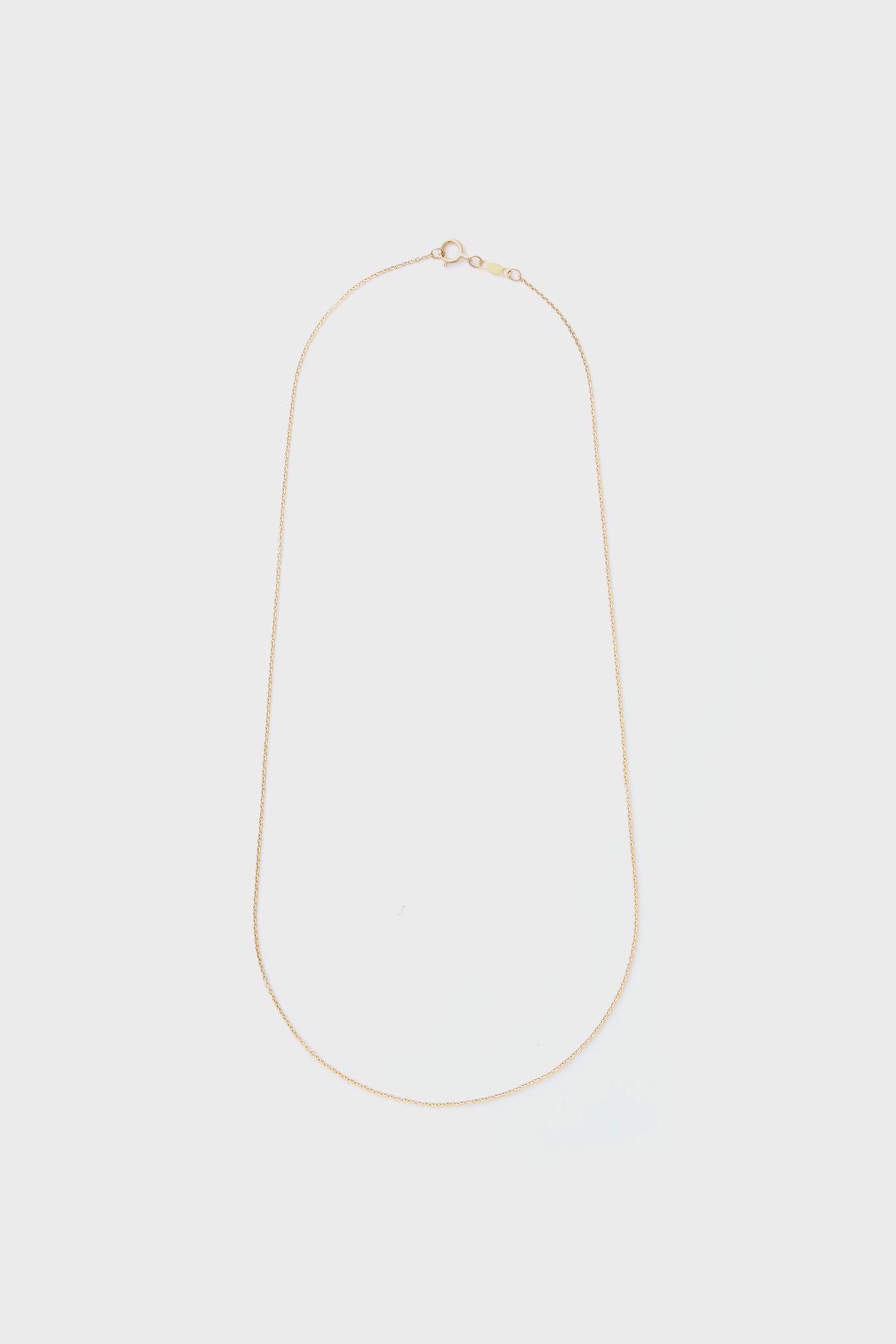 The Tuckernuck Fine Jewelry 14k gold rope chain necklace features a thin design and a small round clasp, ideal for those who appreciate luxury jewelry.