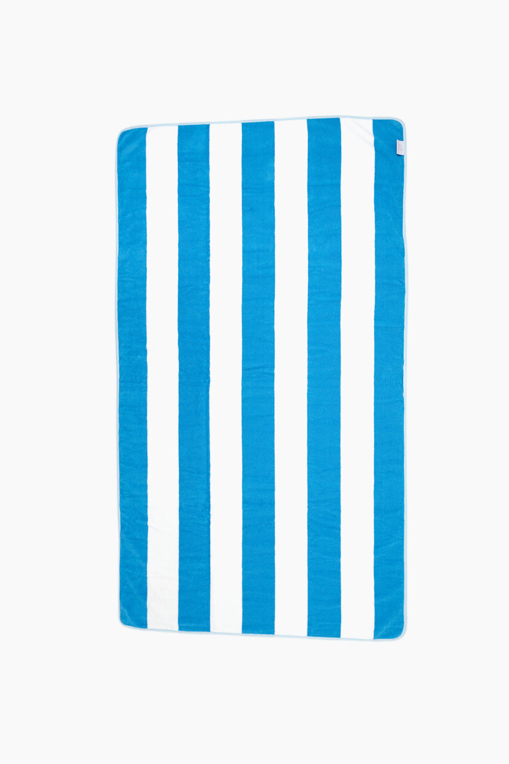 A luxurious rectangular beach towel from Weezie featuring alternating vertical blue and white stripes is shown, perfect for relaxing by the water.
