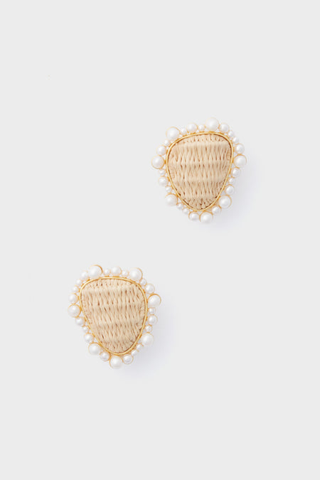 A pair of woven, teardrop-shaped earrings bordered with small white beads from Tuckernuck Jewelry.