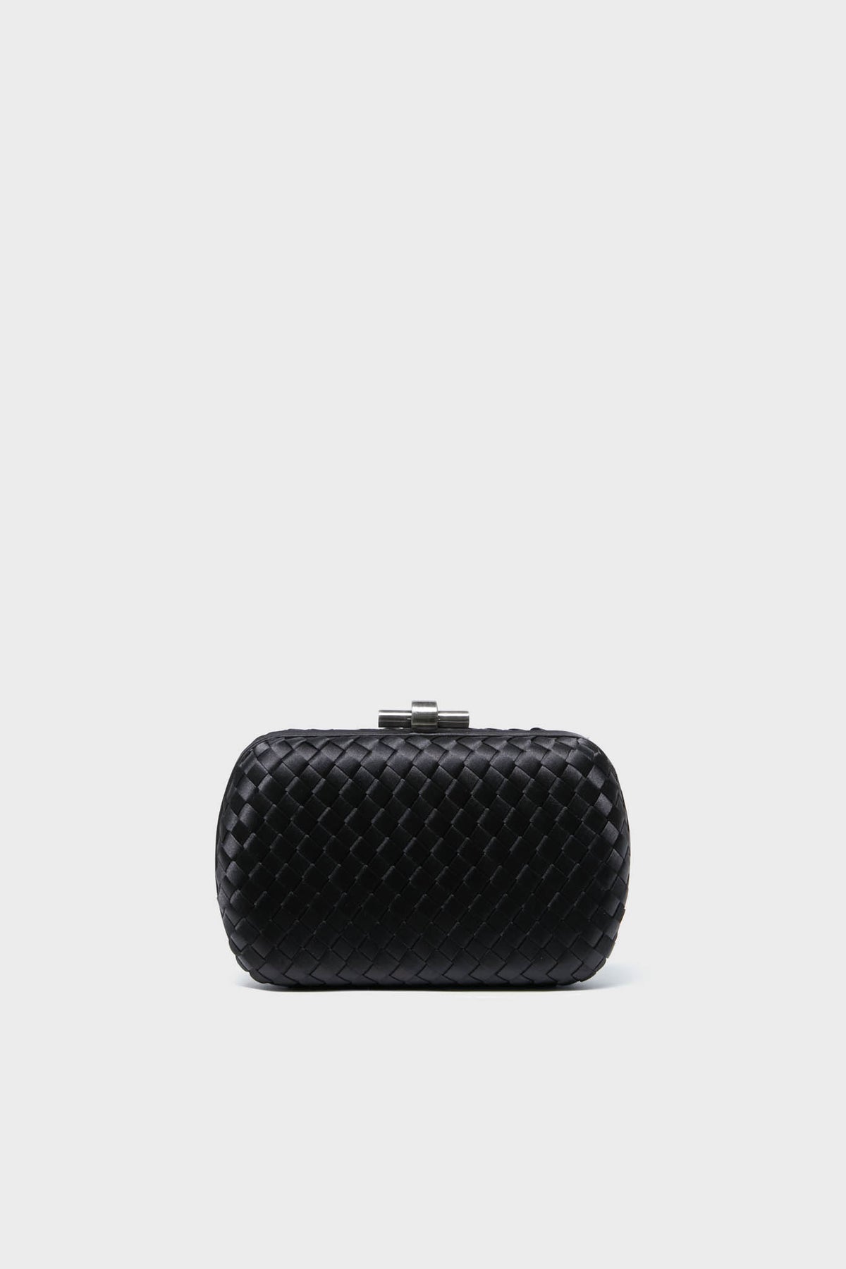 The Olga Berg small black woven clutch features a metallic clasp, making it perfect as an evening bag or a special occasion accessory.