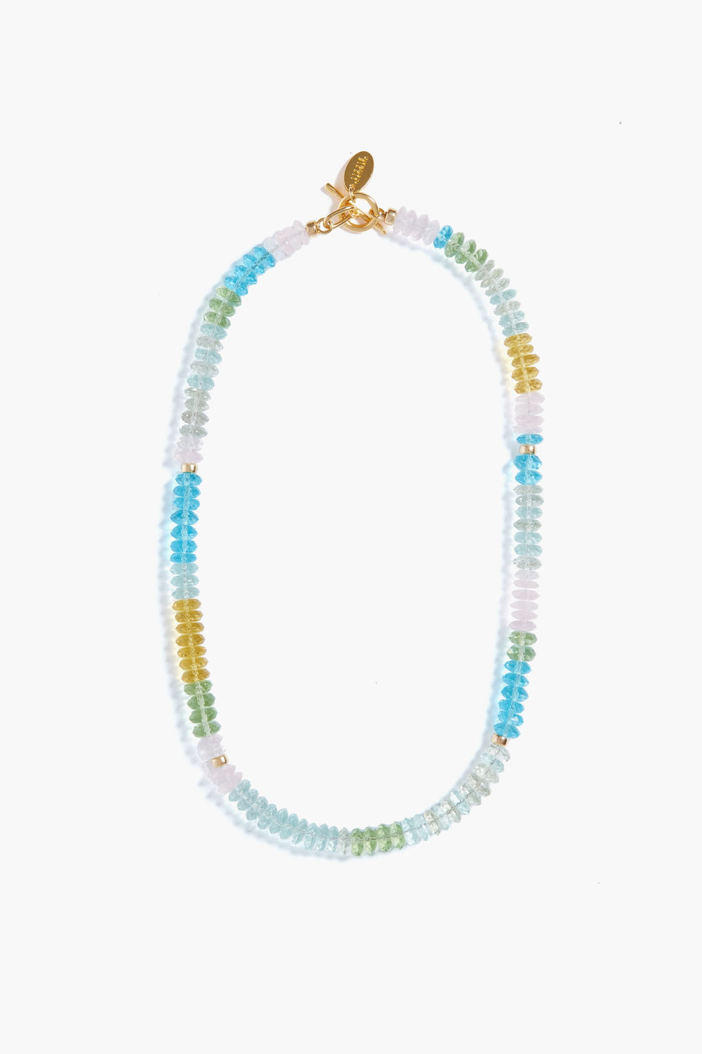 The Lizzie Fortunato Coast Necklace is a handcrafted piece featuring alternating blue, green, yellow, and clear beads, finished with a gold clasp and a small gold tag.