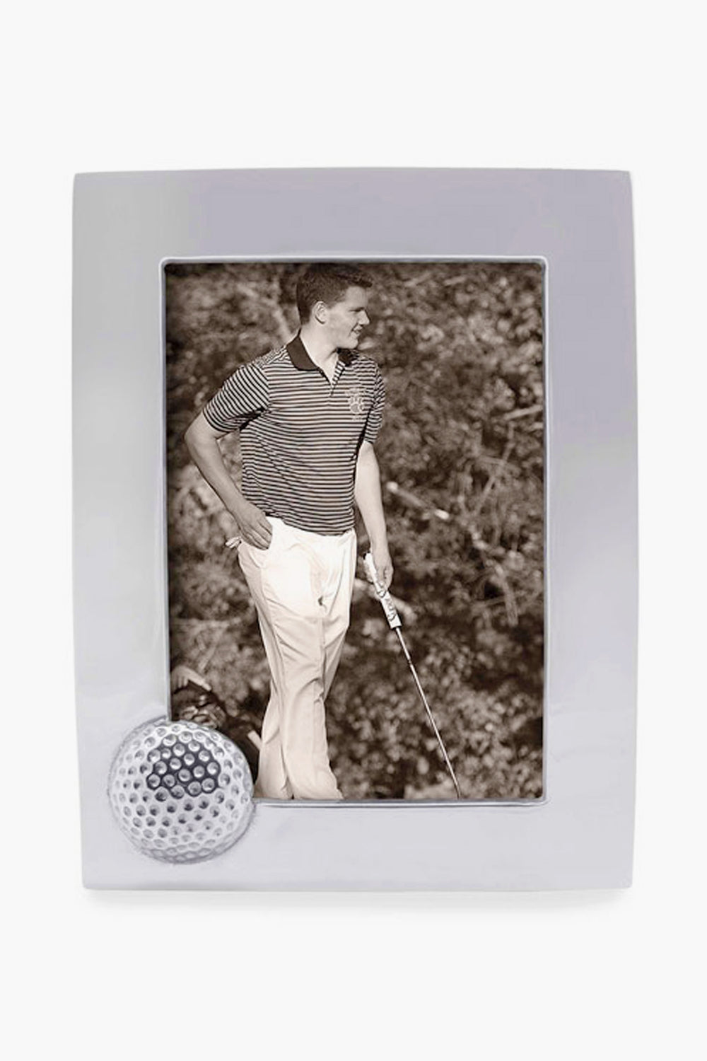 A black-and-white photo of a man in a striped polo and light pants holding a golf club, displayed in a handcrafted Mariposa golf ball frame.