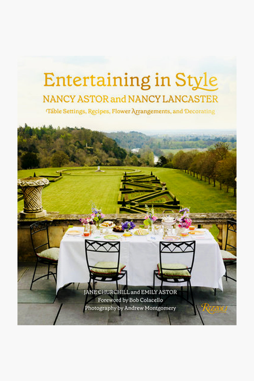 Cover of the Rizzoli book Entertaining in Style, showing an outdoor dining table with plates and glasses, inspired by Nancy Lancaster’s English country house entertaining, set against landscaped gardens and rolling hills.