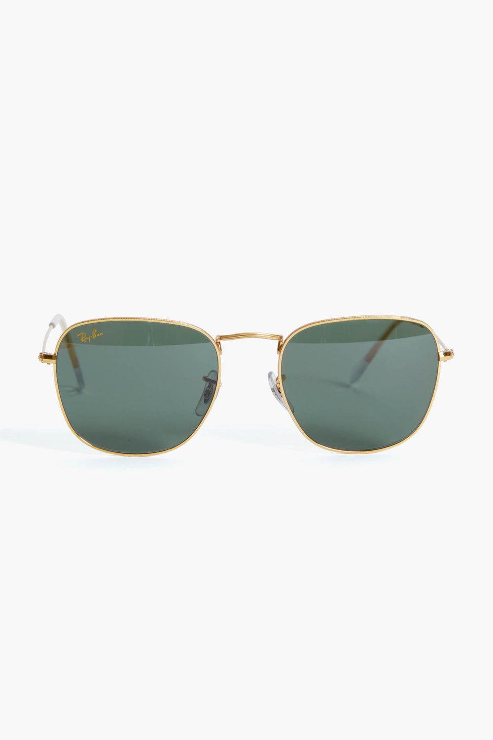 Ray-Ban sunglasses featuring green lenses and a sleek square frame design.