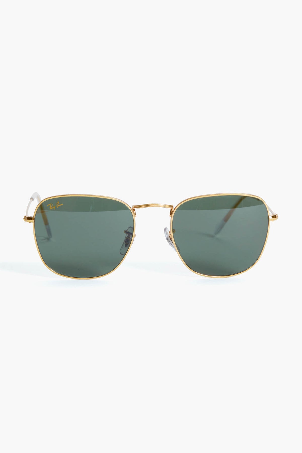 Ray-Ban sunglasses featuring green lenses and a sleek square frame design.