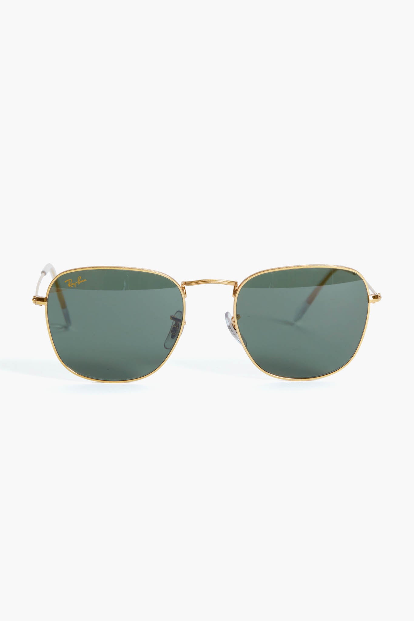 Ray-Ban sunglasses featuring green lenses and a sleek square frame design.