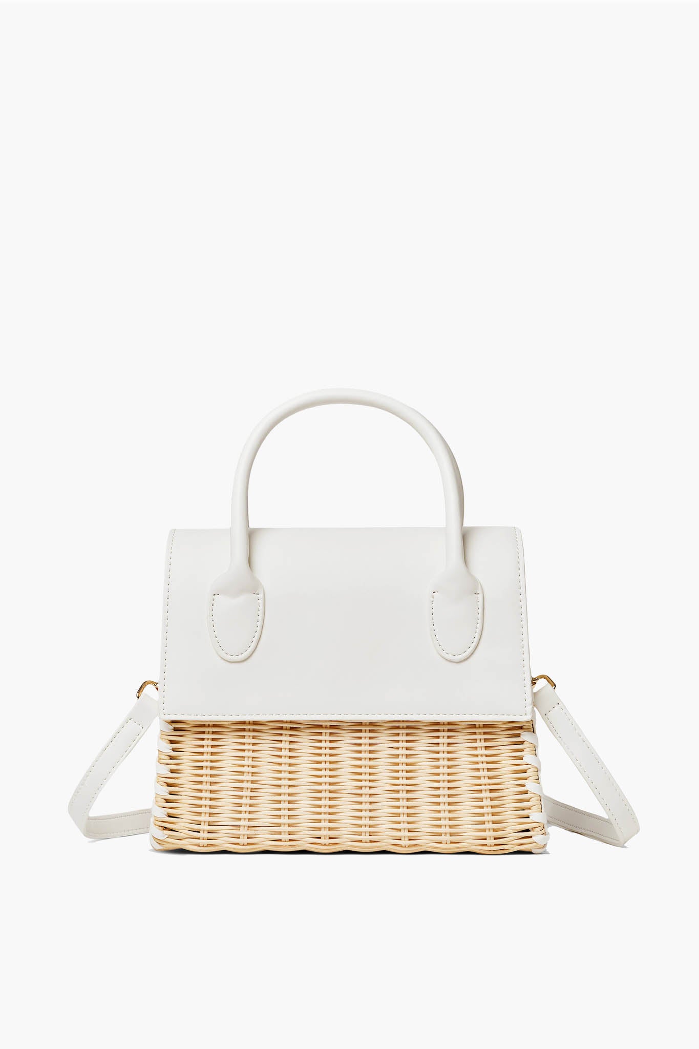 The Urban Expressions handbag features a white leather top, handles, and flap, paired with a woven straw bottom and an adjustable shoulder strap.