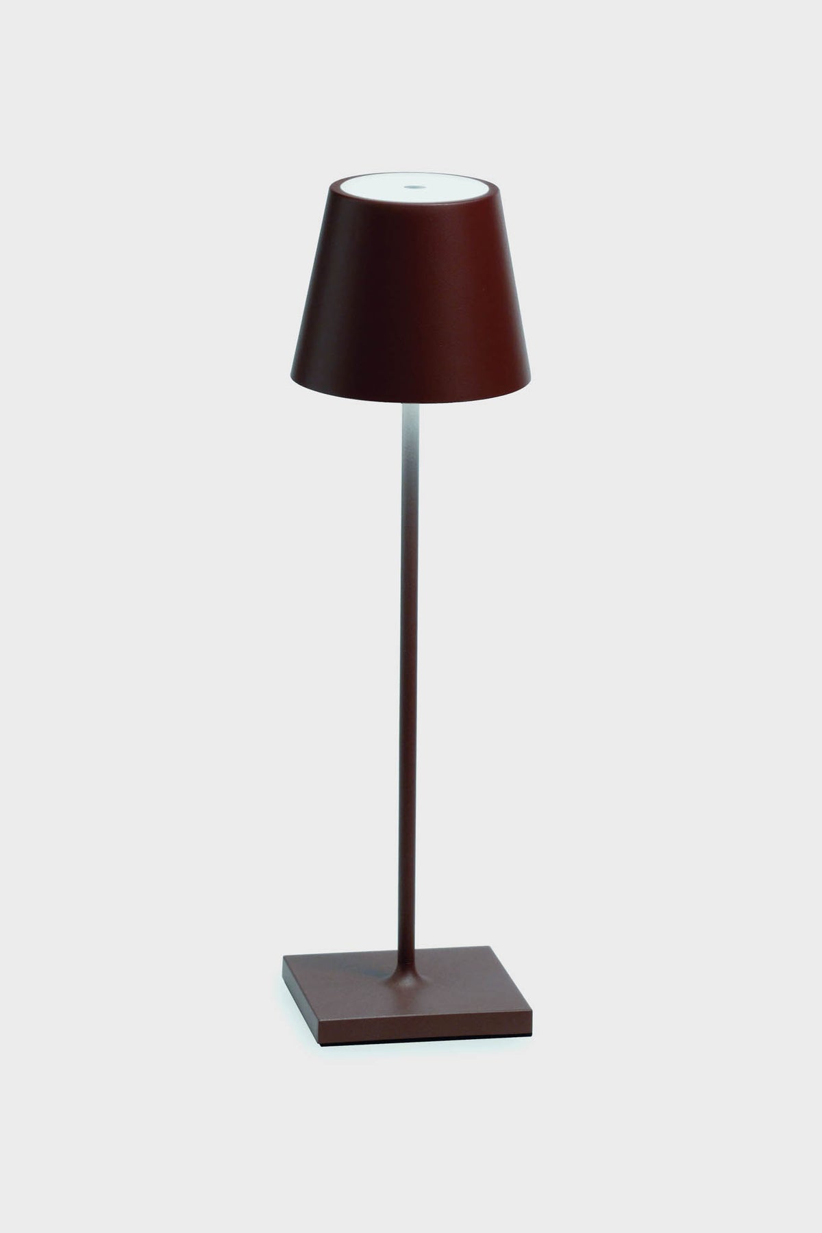 The Zafferano LED table lamp features a modern, minimalist design with a brown base, slender stem, and conical shade, adding elegance to any space.