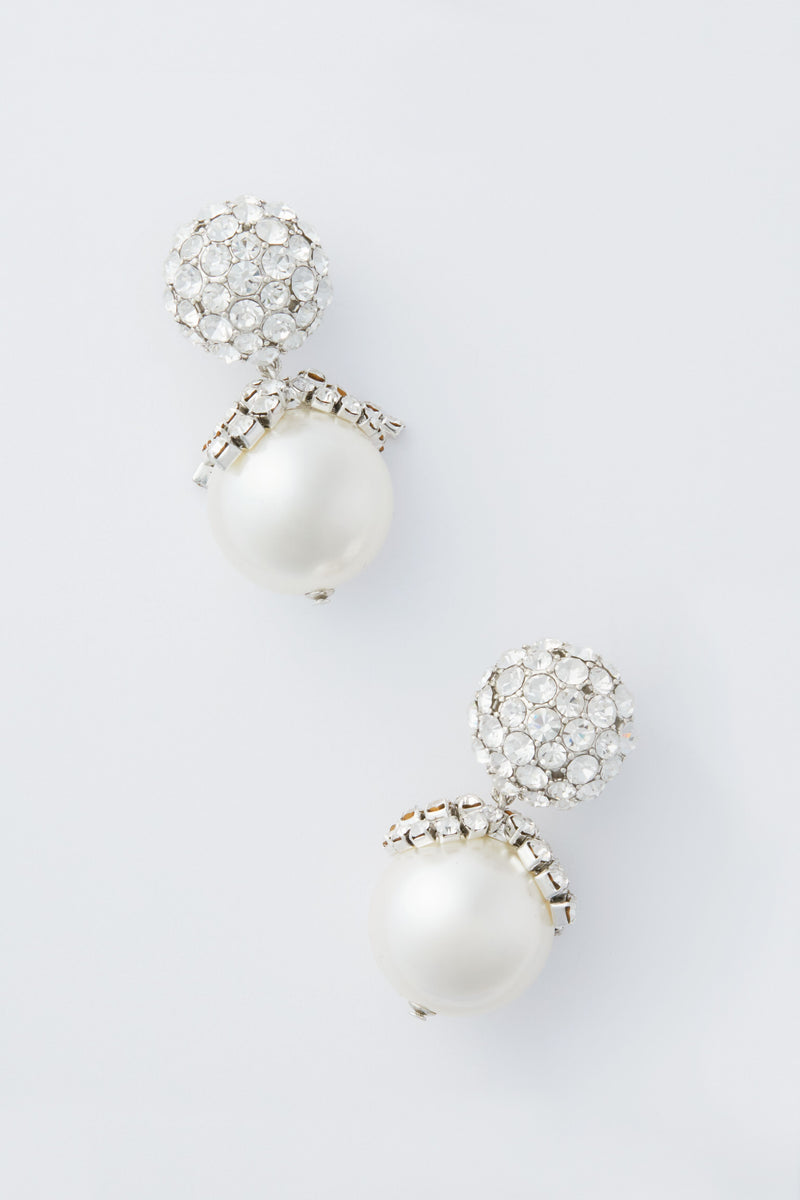 Tuckernuck Jewelry dangle earrings with round white pearls and clusters of clear gemstones add an elegant touch to any outfit.
