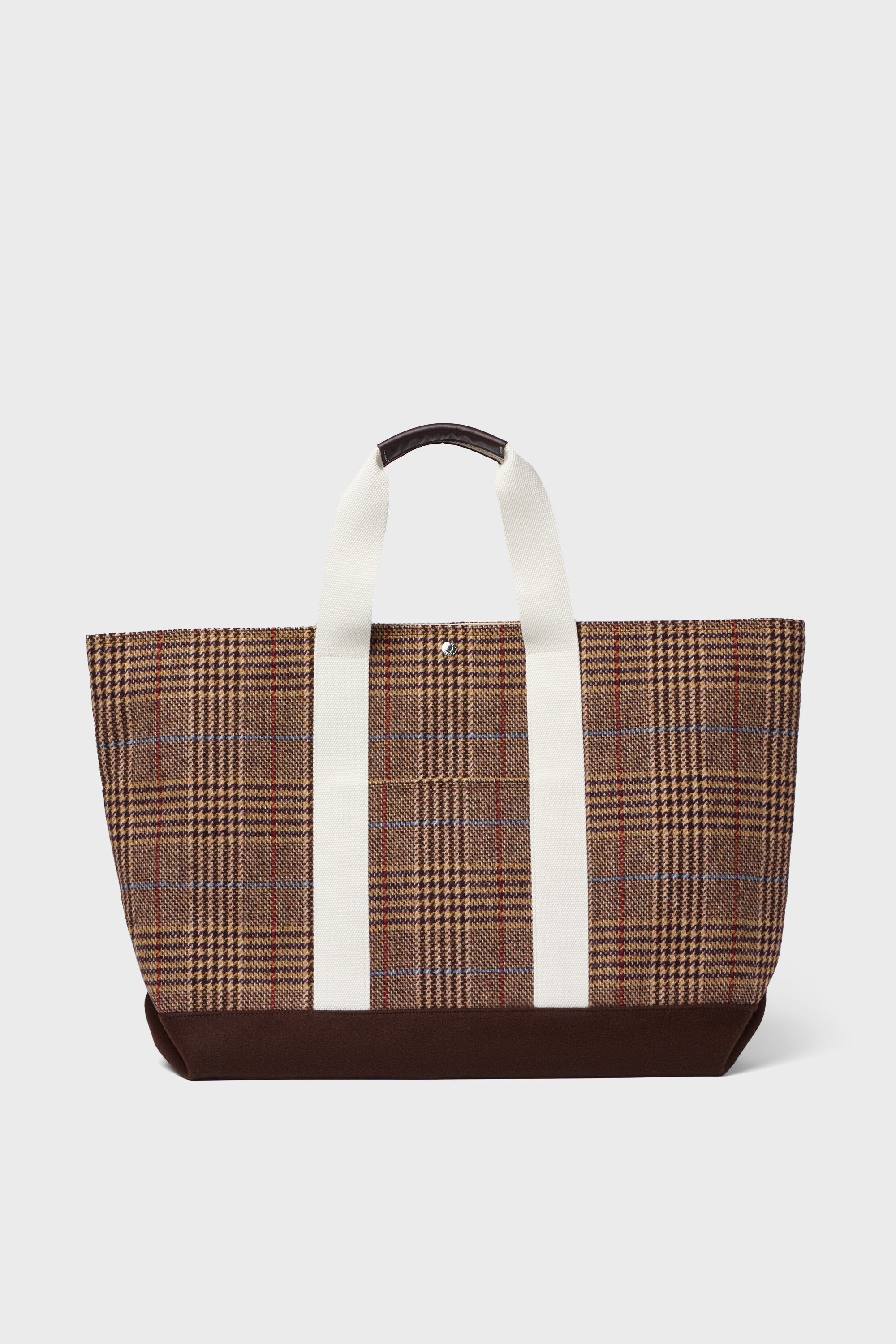 The Rue de Verneuil brown plaid wool tote features white handles and a dark brown base, making it a stylish weekender bag.