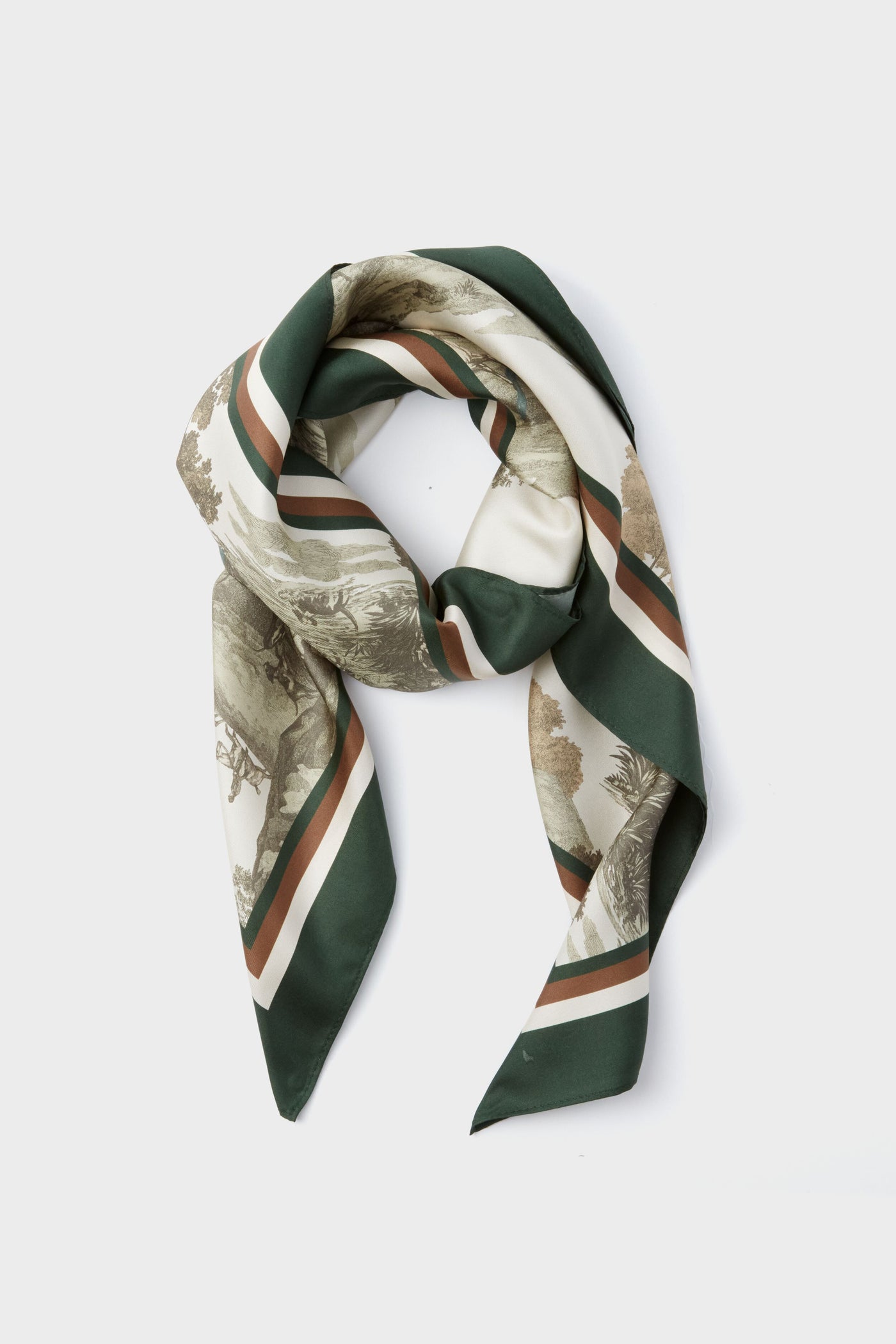 The Tuckernuck Accessories medium silk scarf features green, beige, and brown stripes with a scenic custom print, loosely knotted for a stylish look.