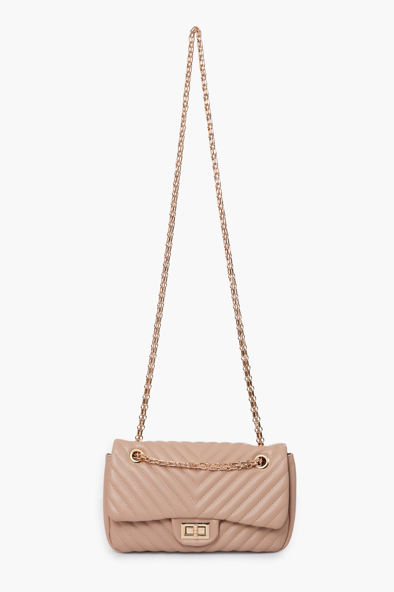Urban Expressions beige quilted vegan handbag features a gold chain strap and a rectangular gold clasp on the front flap.