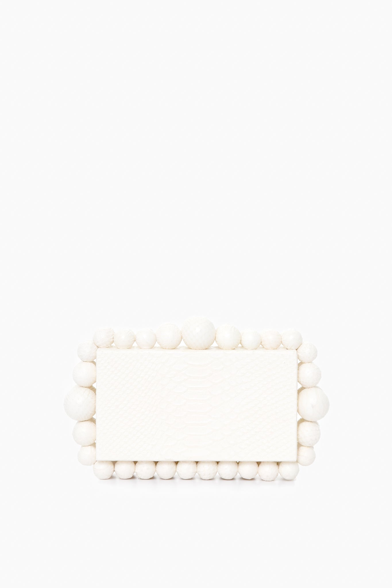 A white rectangular Cult Gaia box clutch with a textured, snakeskin-embossed leather surface and large round beads accenting the edges.
